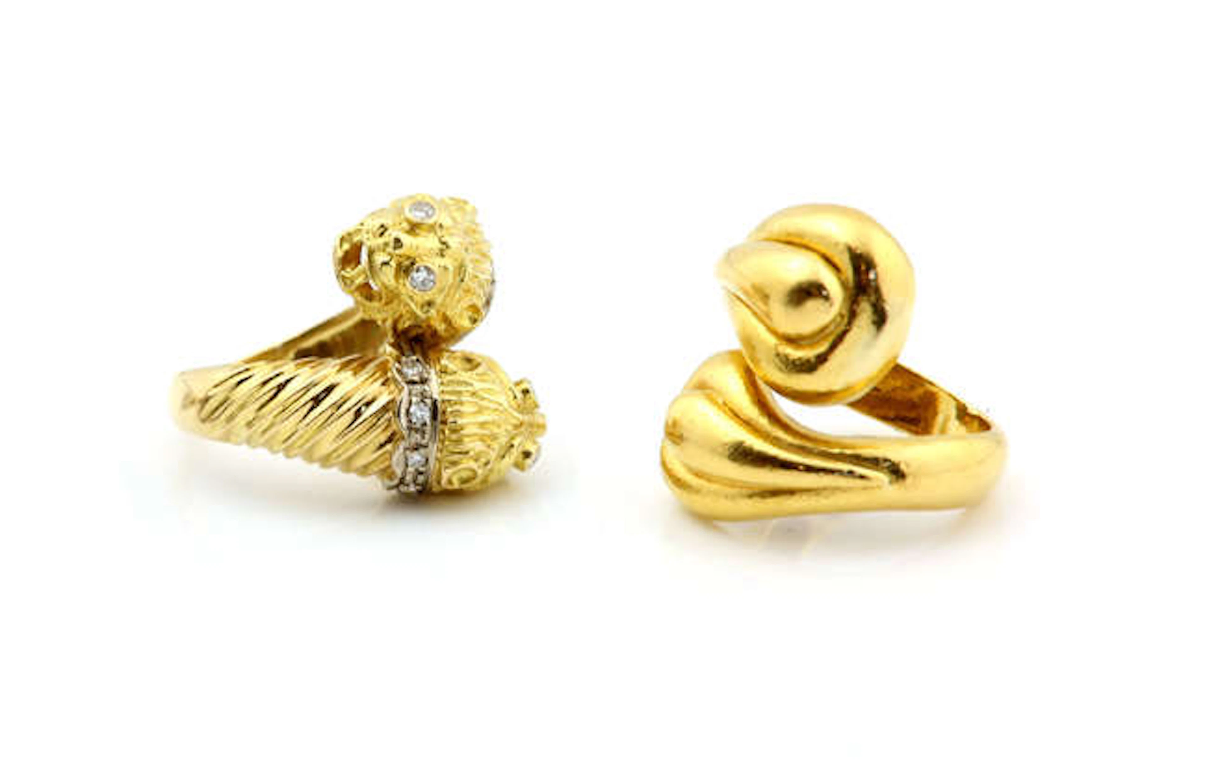 Ilias Lalounis a gold ring with two Etruscan style lions heads