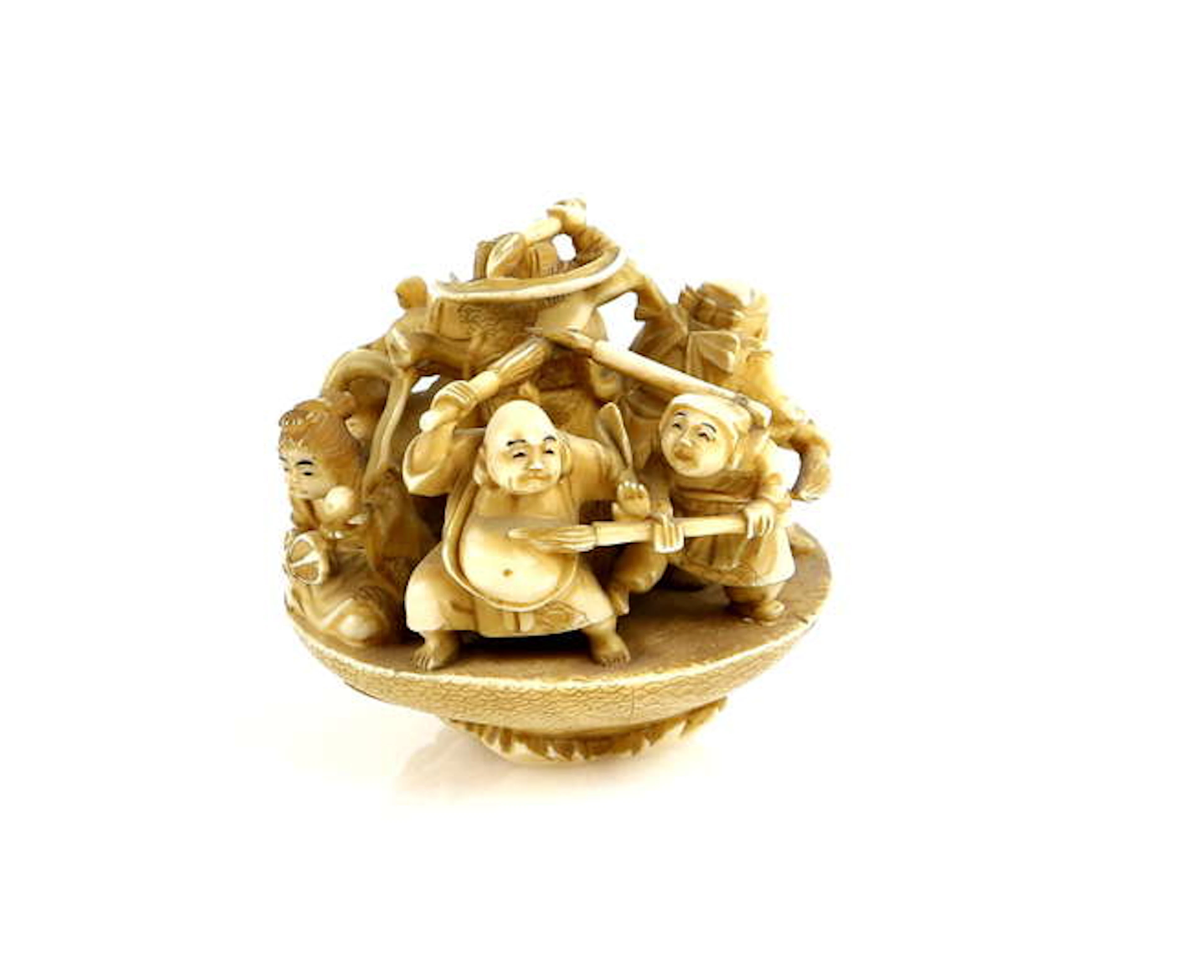 An okimono style netsuke of the Shichifukujin in a...