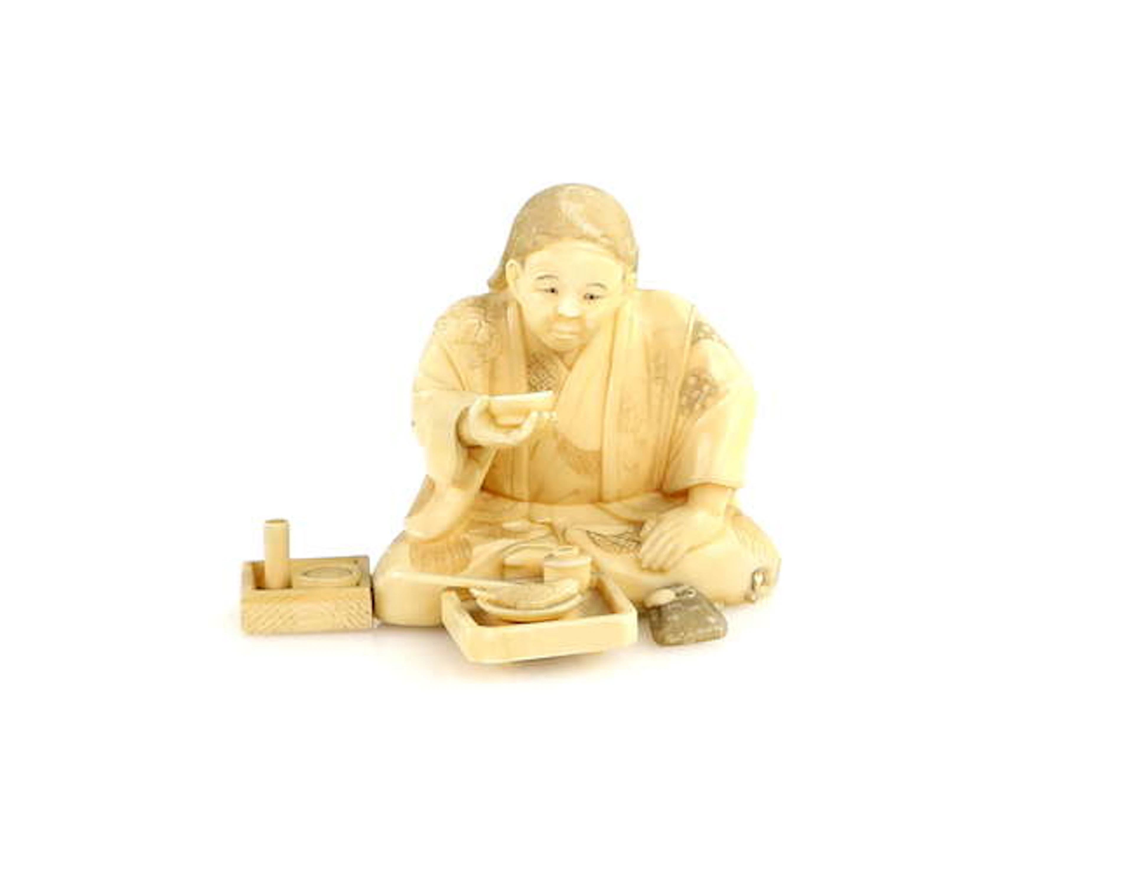 A sectional ivory okimono
