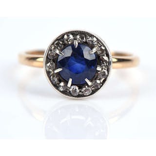 Sapphire and diamond ring, with central round cut sapphire, with a