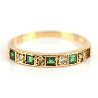An emerald and diamond half eternity ring, mounted in 18 ct, ring size S