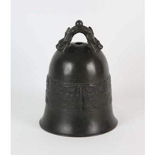 A Chinese bronze bell with mythological animal handle, decorated with