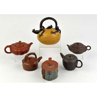 Six teapots, all presumably incorporating the Yixing Clay and tradition