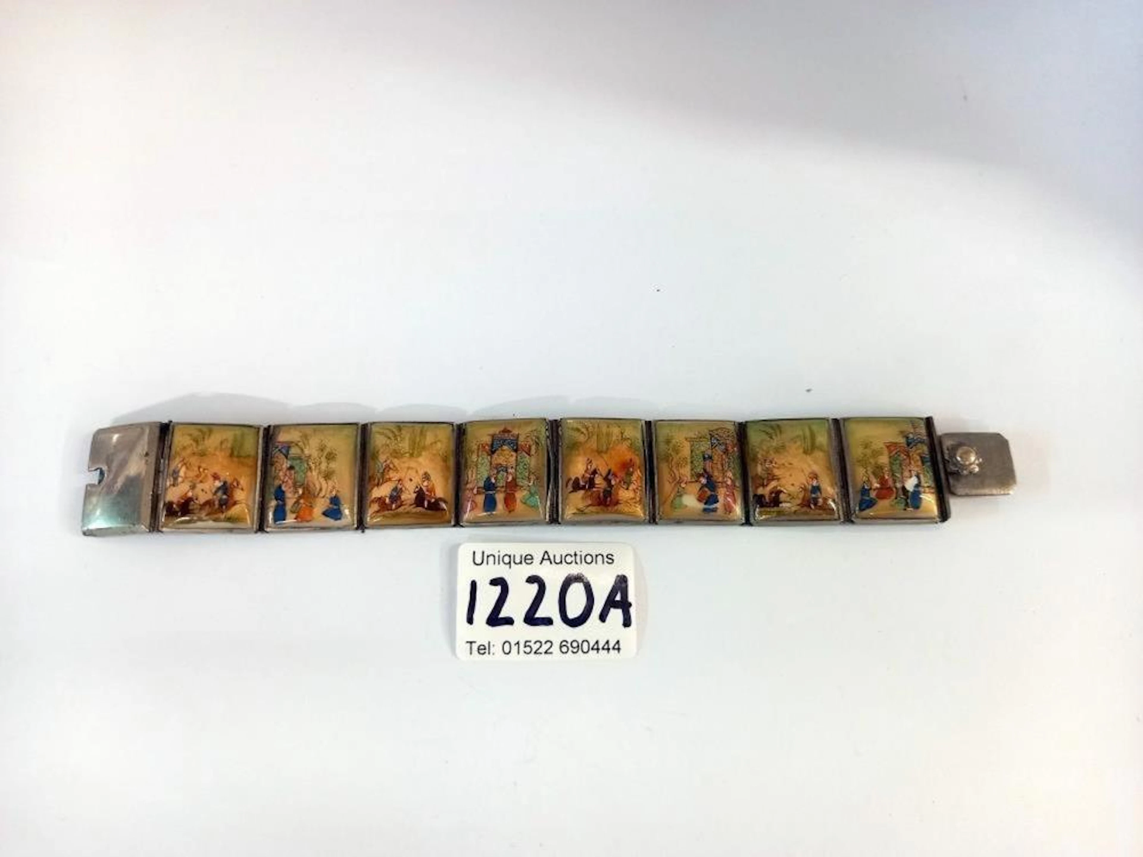 A Persian /Chinese silver plated enamel panel bracelet composed of 8 panels