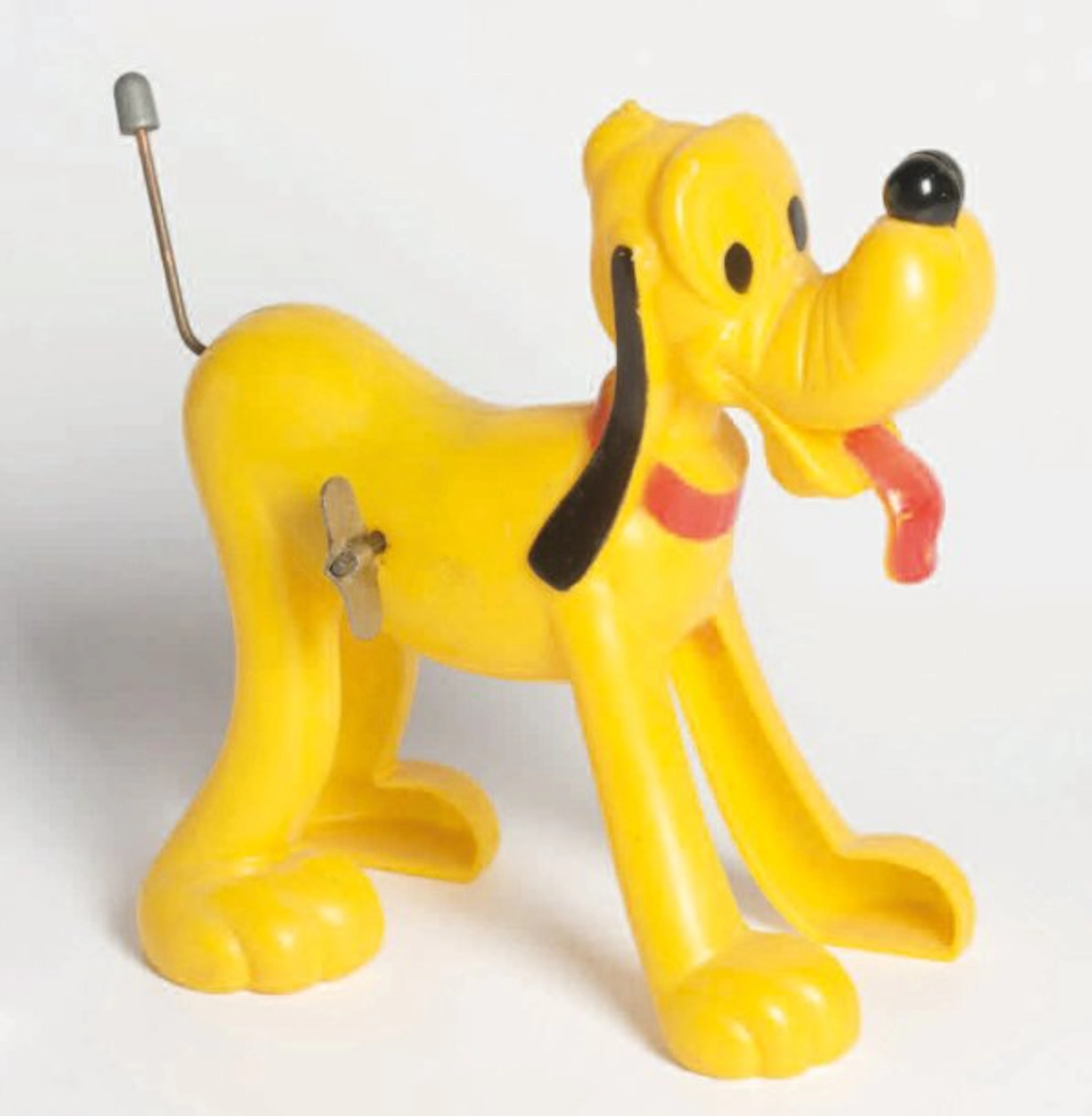 PLUTO "Wind up" en plastique dur jaune et