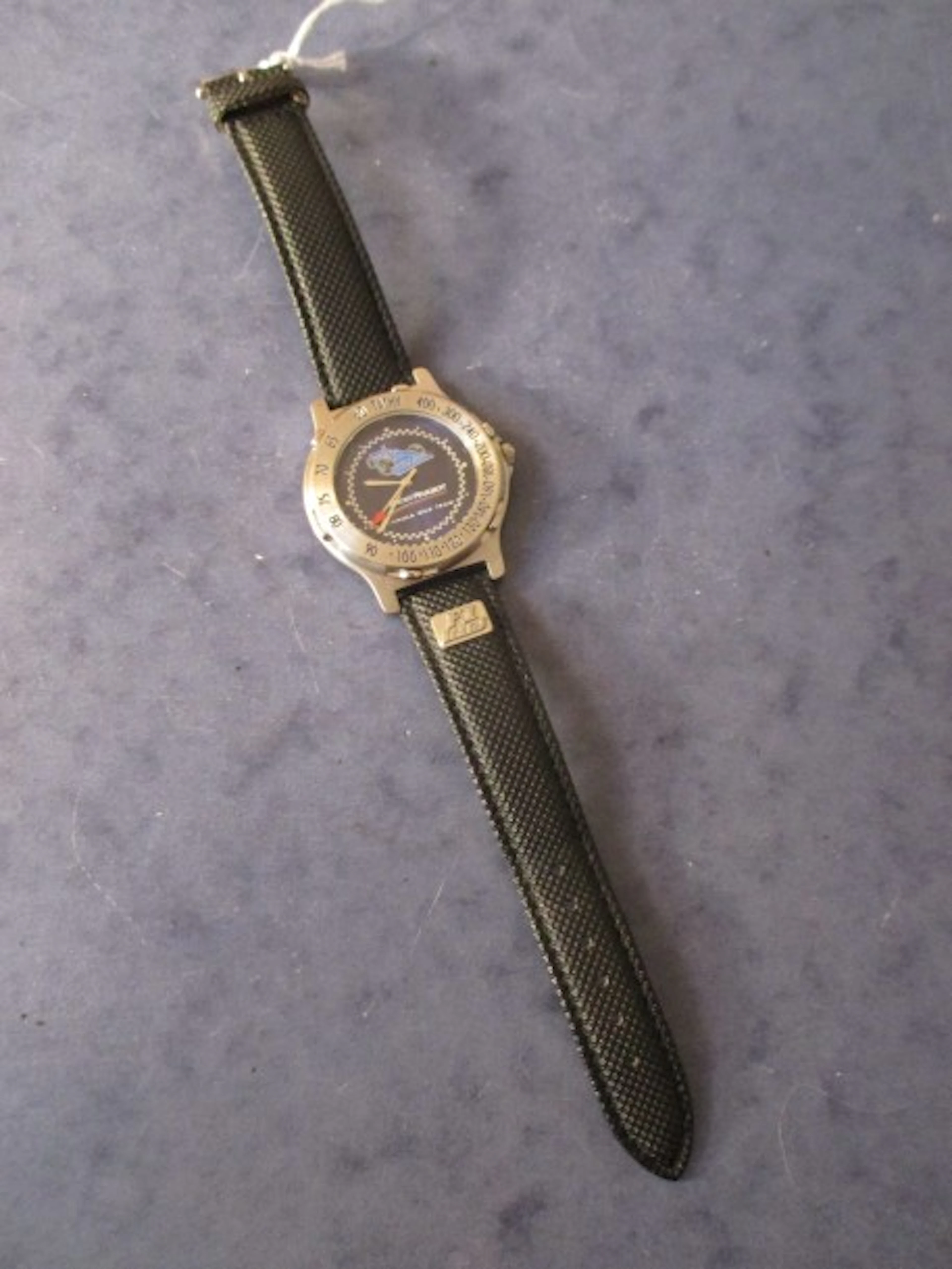 PROST PEUGEOT - ARTHUS-BERTRAND éditeur Montre ronde en acier...