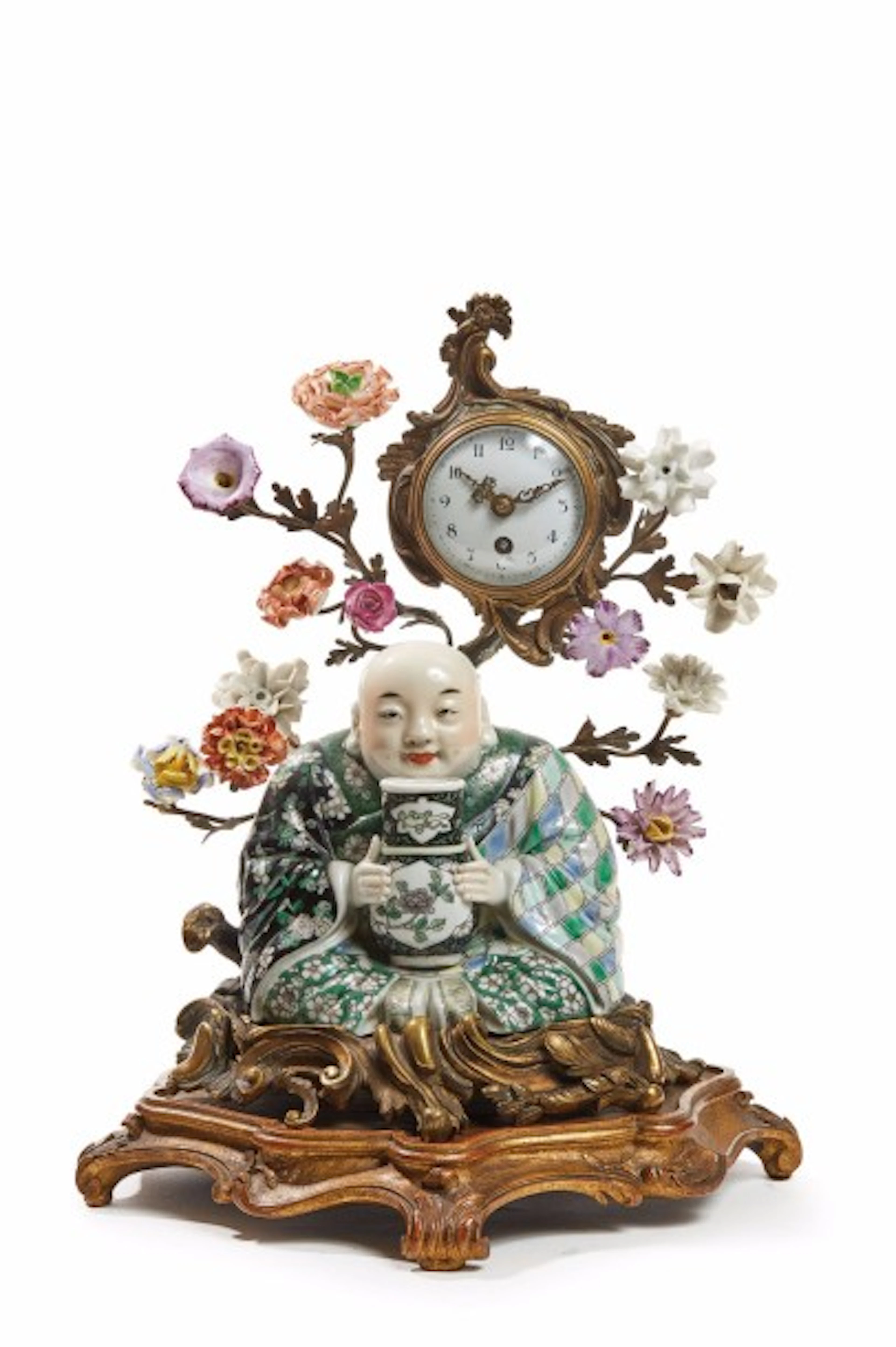 Petite pendule à poser comprenant un magot en porcelaine