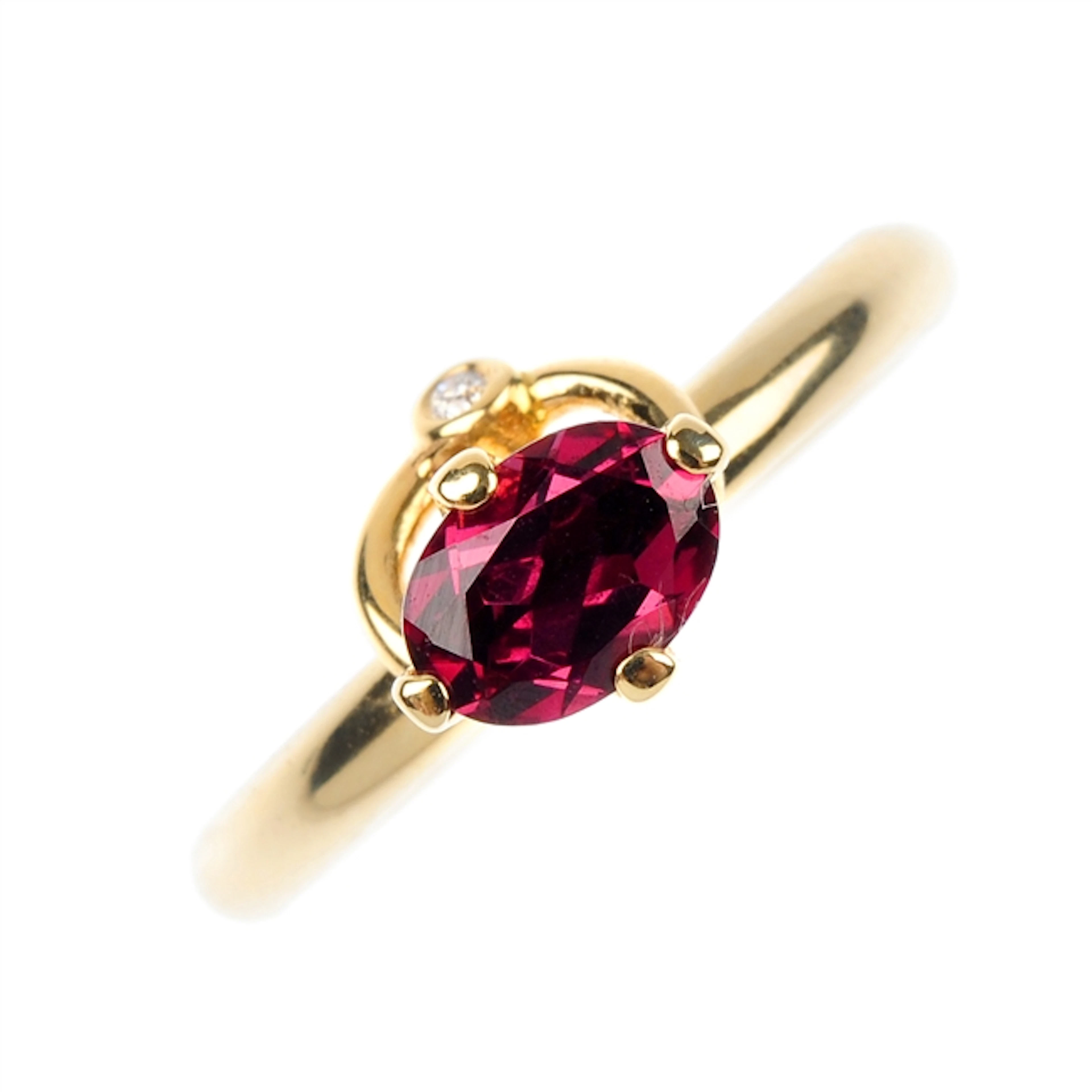 PANDORA - a 14ct gold garnet and diamond dress ring.