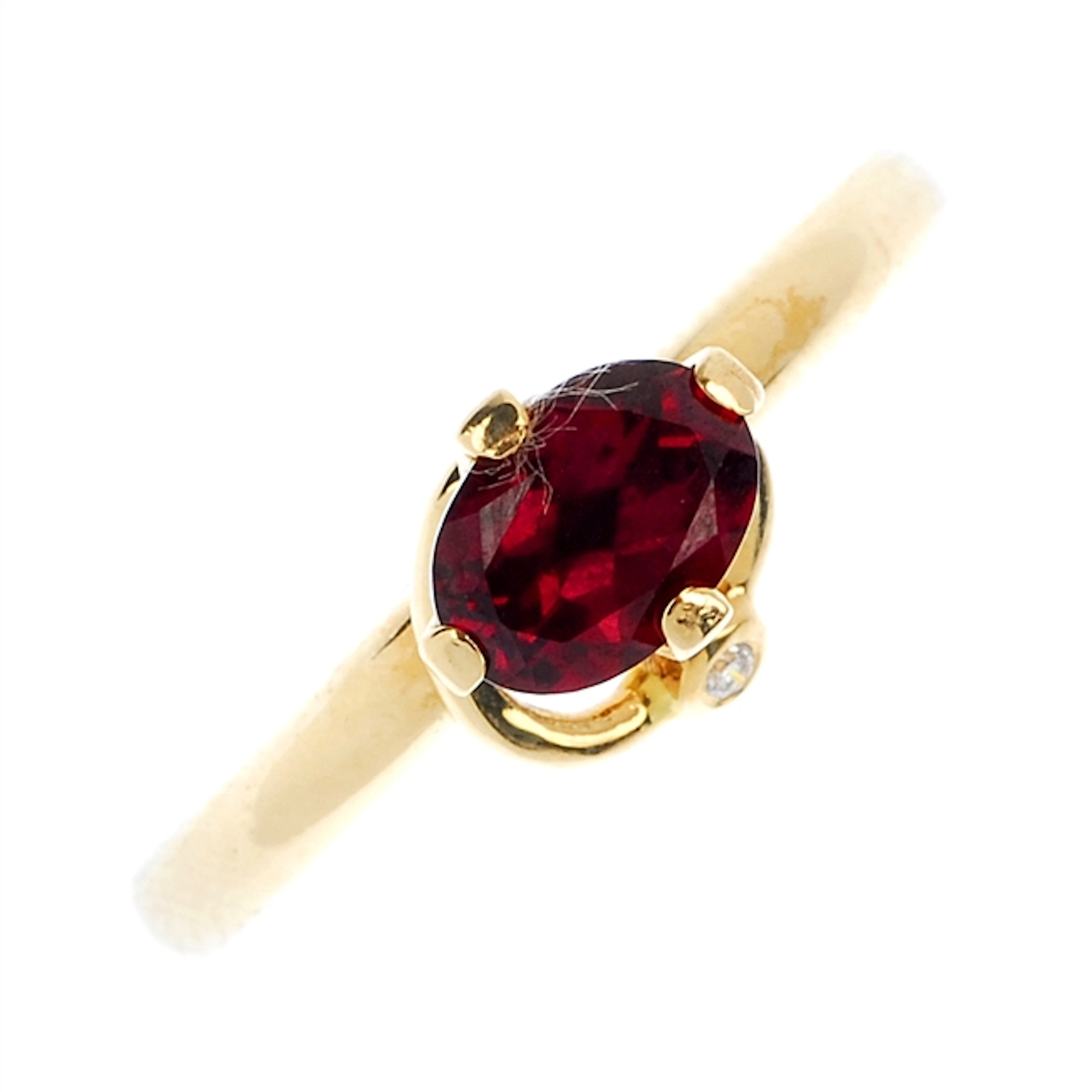 PANDORA - a 14ct gold garnet and diamond dress ring.