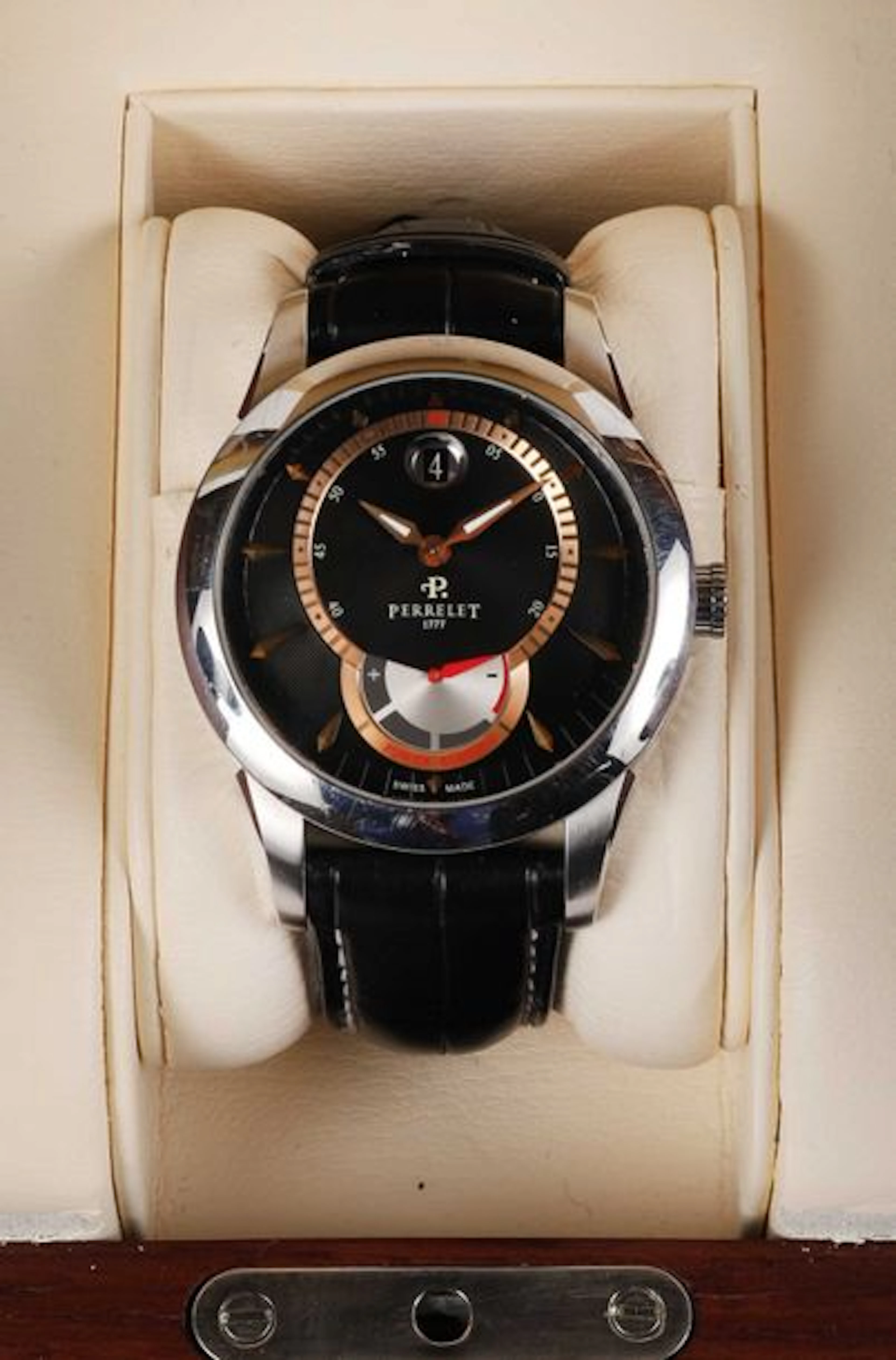 PERRELET. Montre d'homme ronde, en acier.…