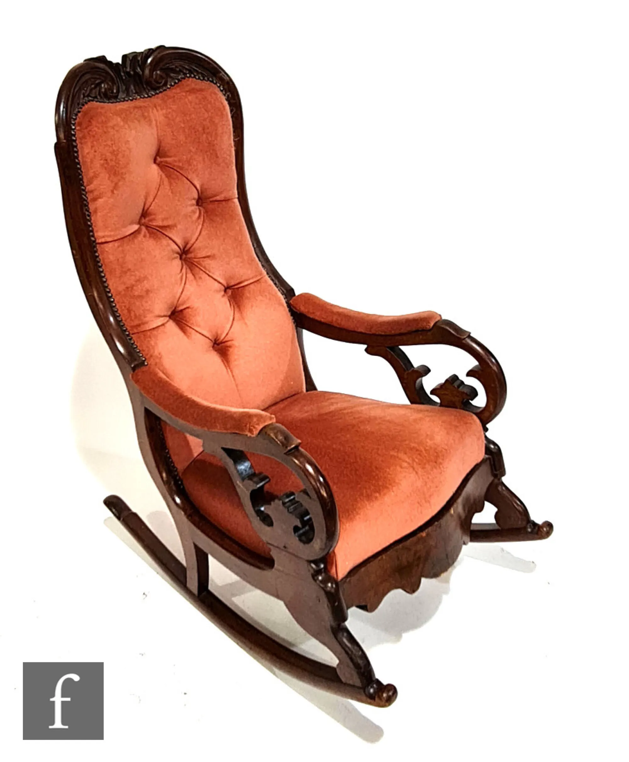 An early Victorian rocking chair with exposed mahogany frame, with ...