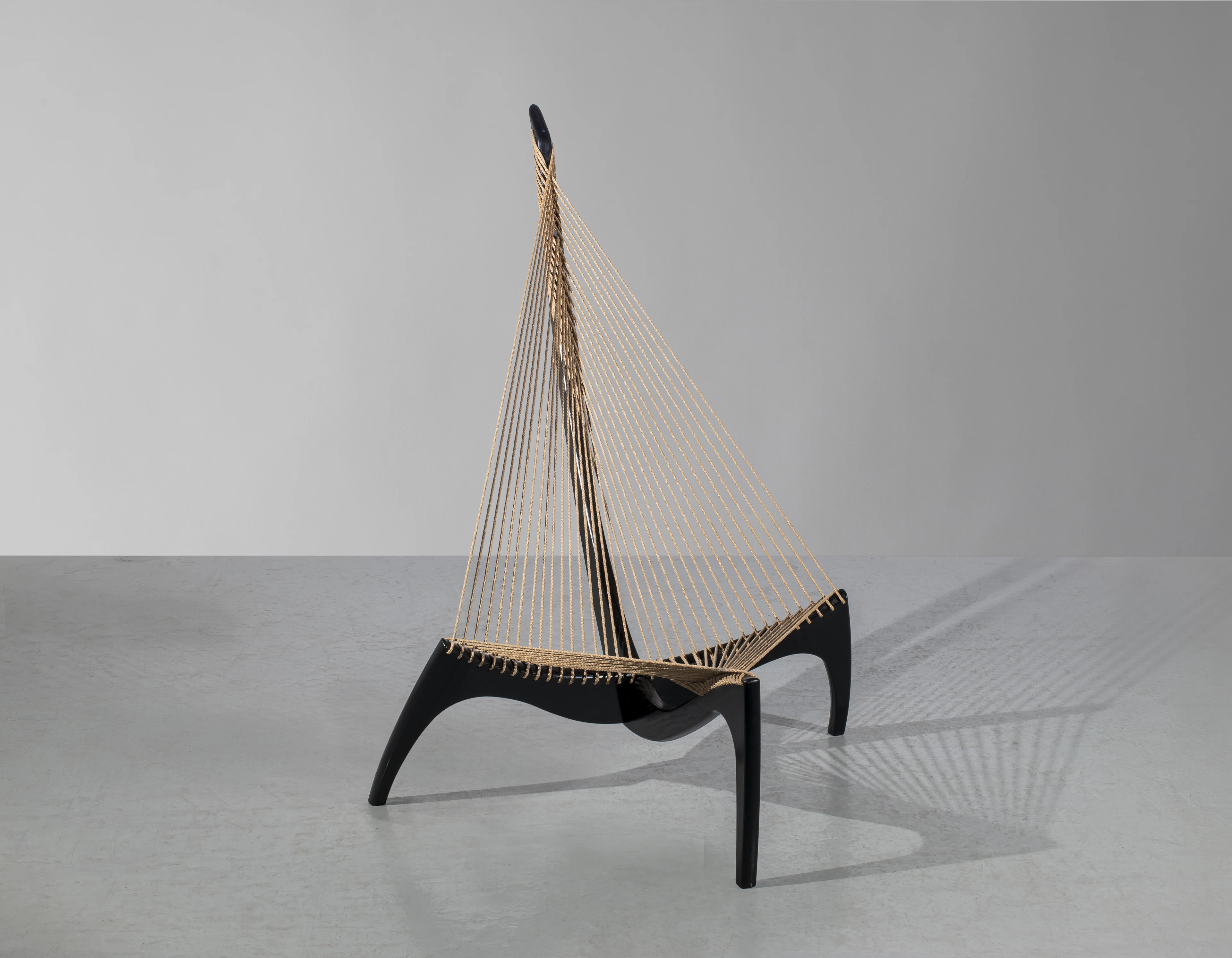 A lacquered wood and robe «Harp» lounge chair by Jorgen...