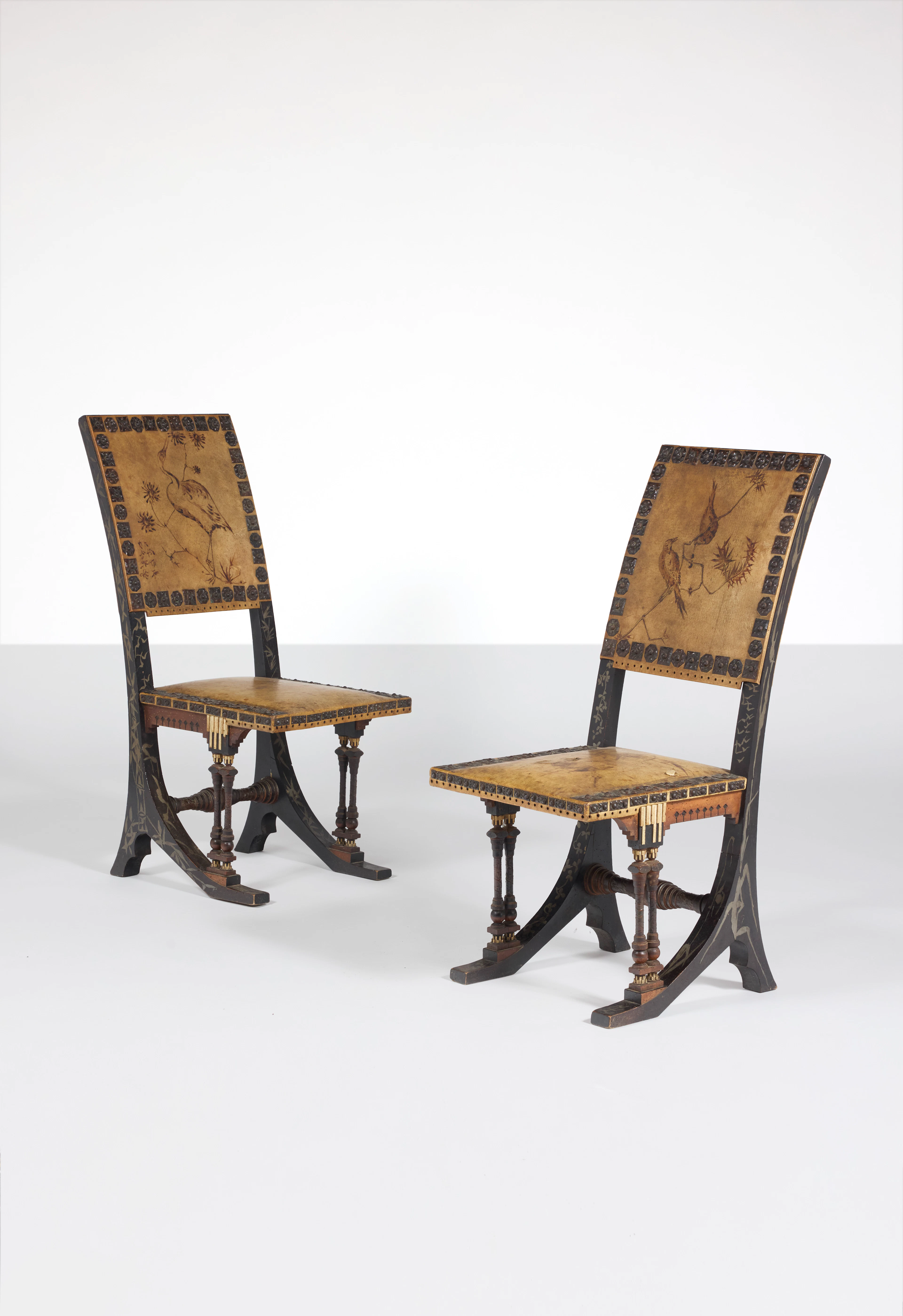 A pair of wood inlaid with pewter