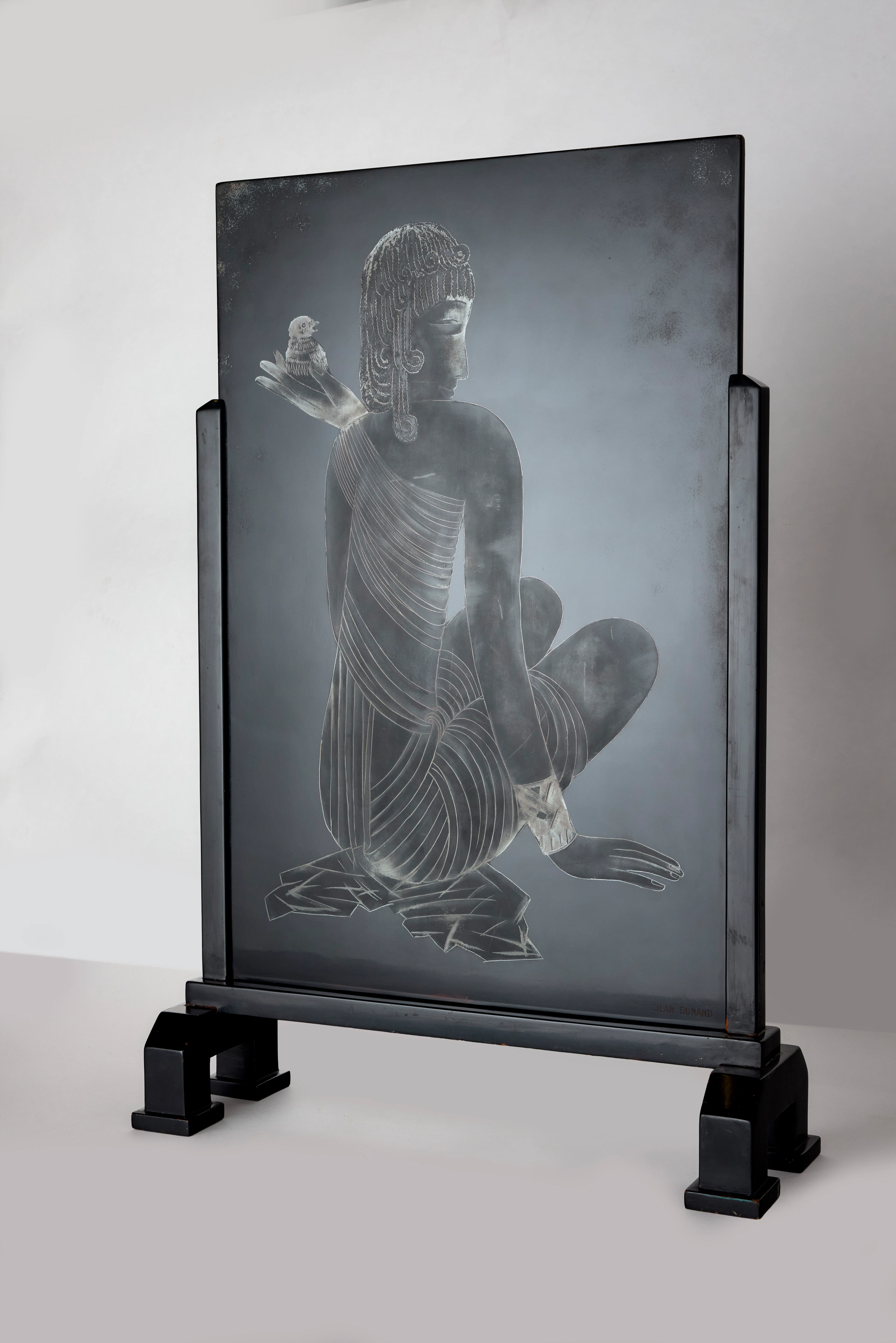 A lacquered wood fire screen Jean Dunand; signed - 1927...
