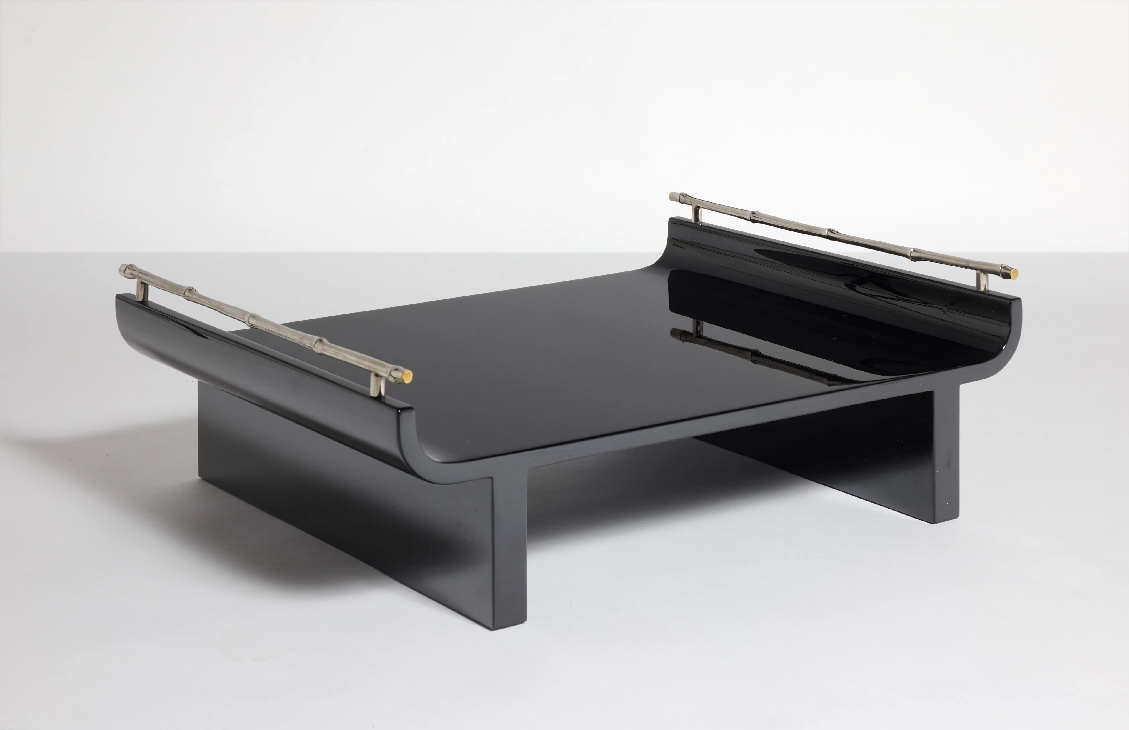 A black lacquered wood and silver-plated metal “Plateau”...
