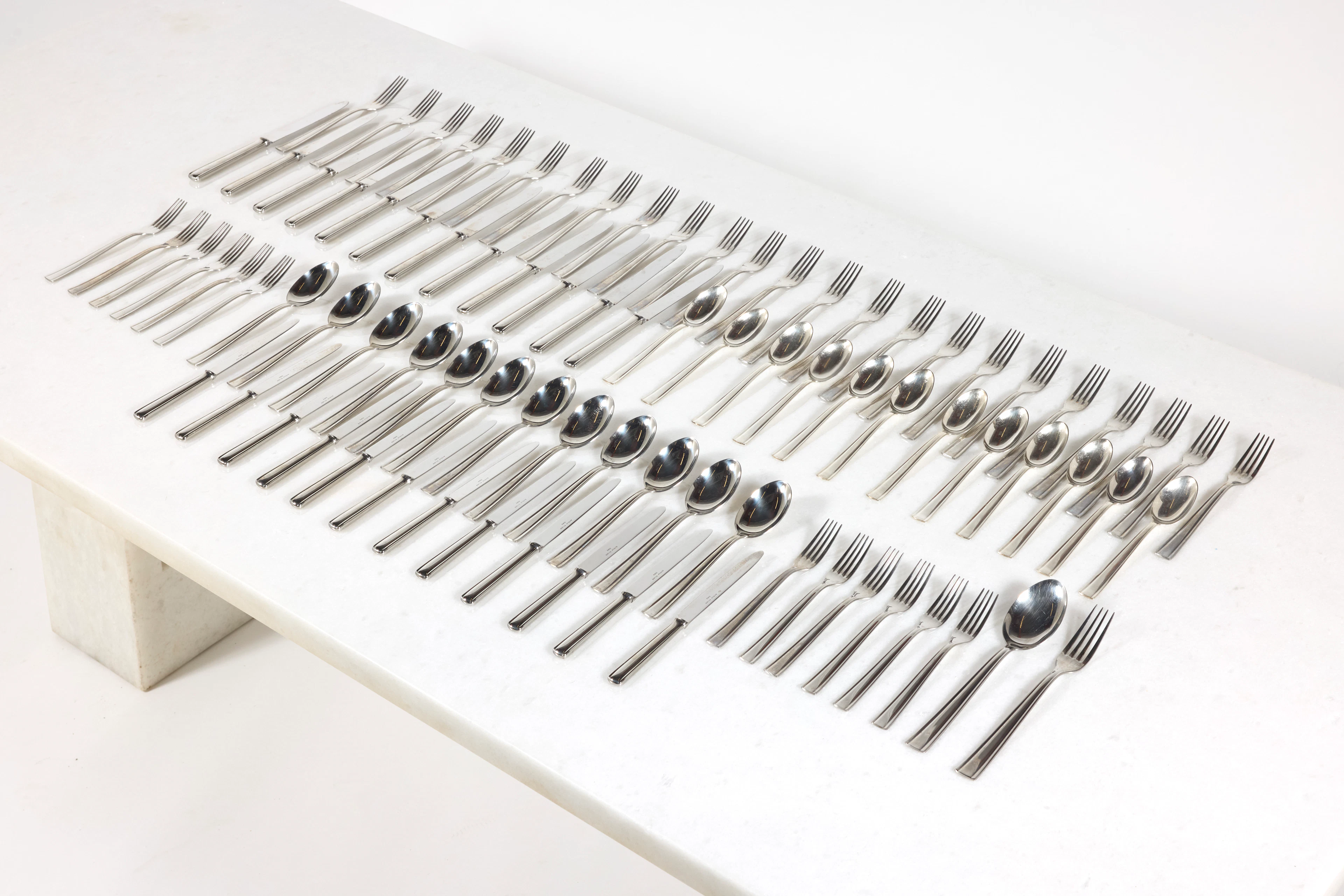 A set of 86 alpaca flatwares for 12 persons by Gio Ponti...