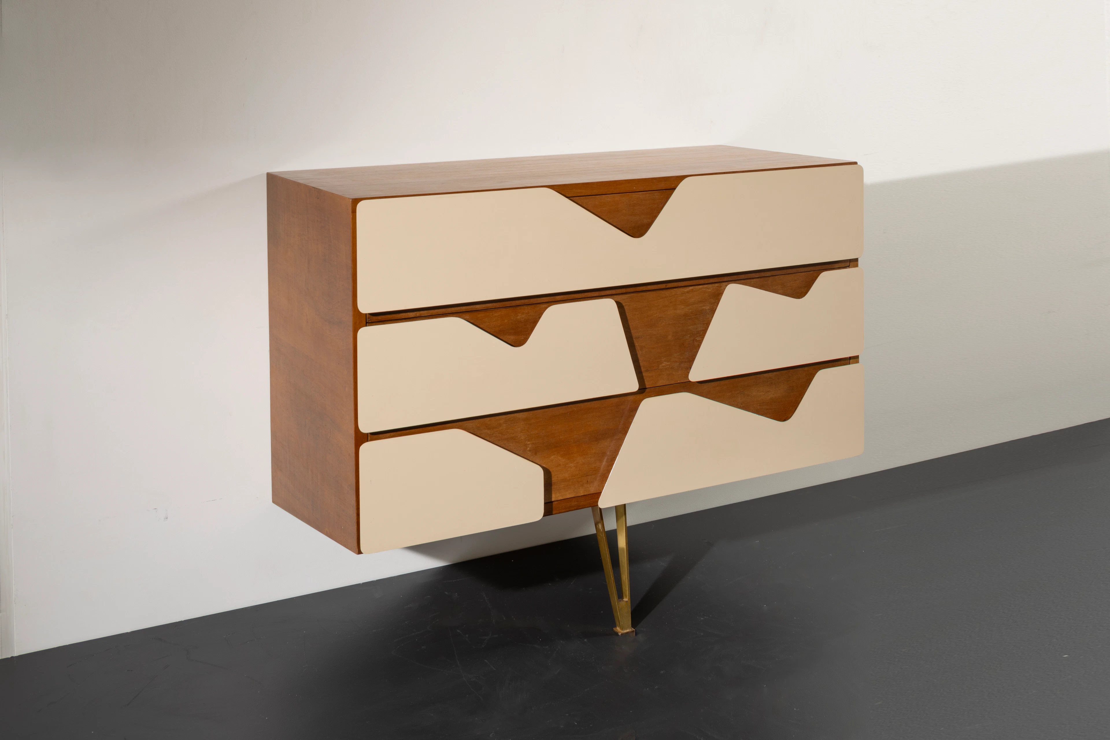 A rare walnut and brass wall cabinet by Gio Ponti for...