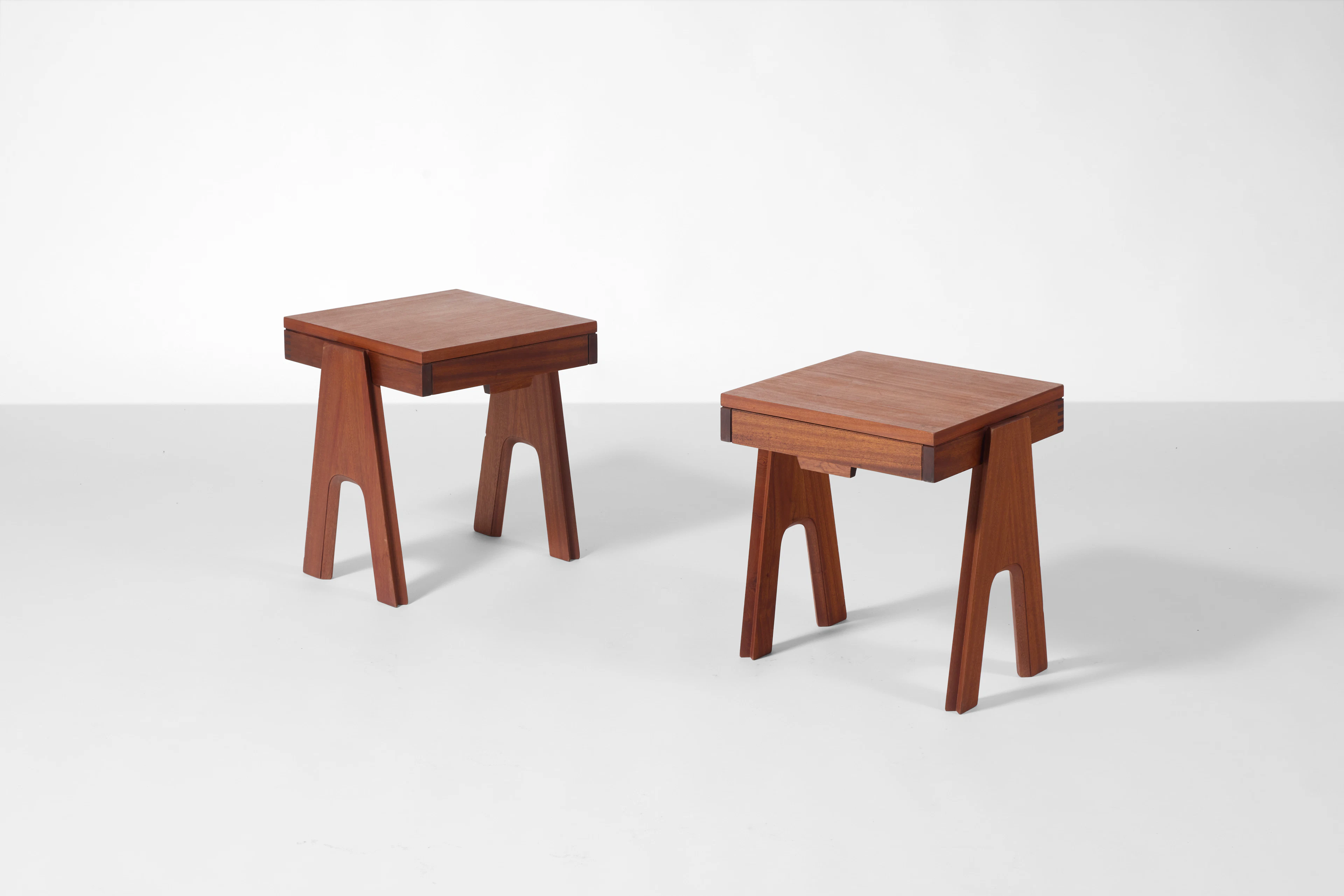 A pair of mahogany modular nightstands by Angelo...