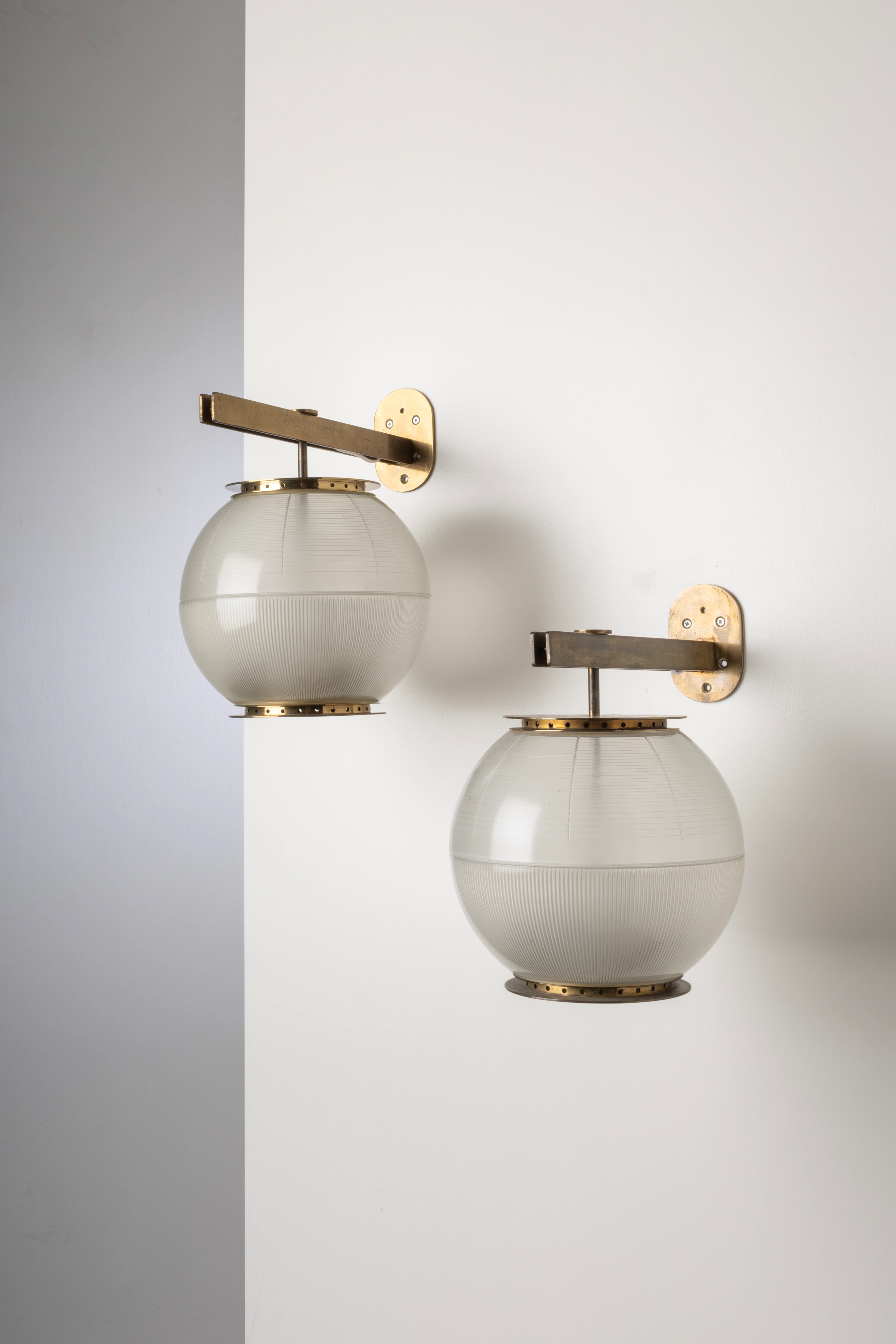 A pair of brass and glass mod