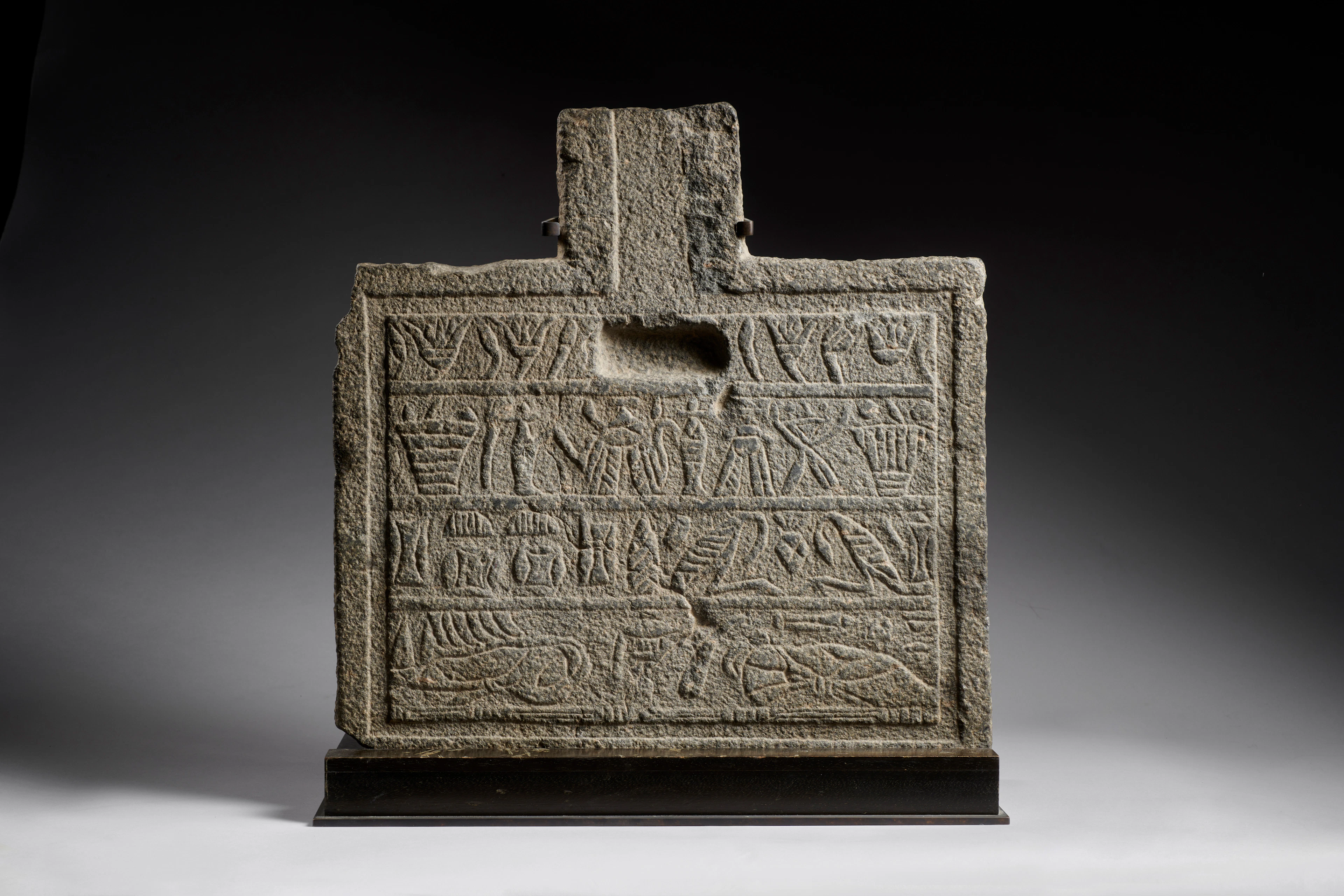 An Egyptian granite offering table, Ptolemaic Period, 332-30 B.C.