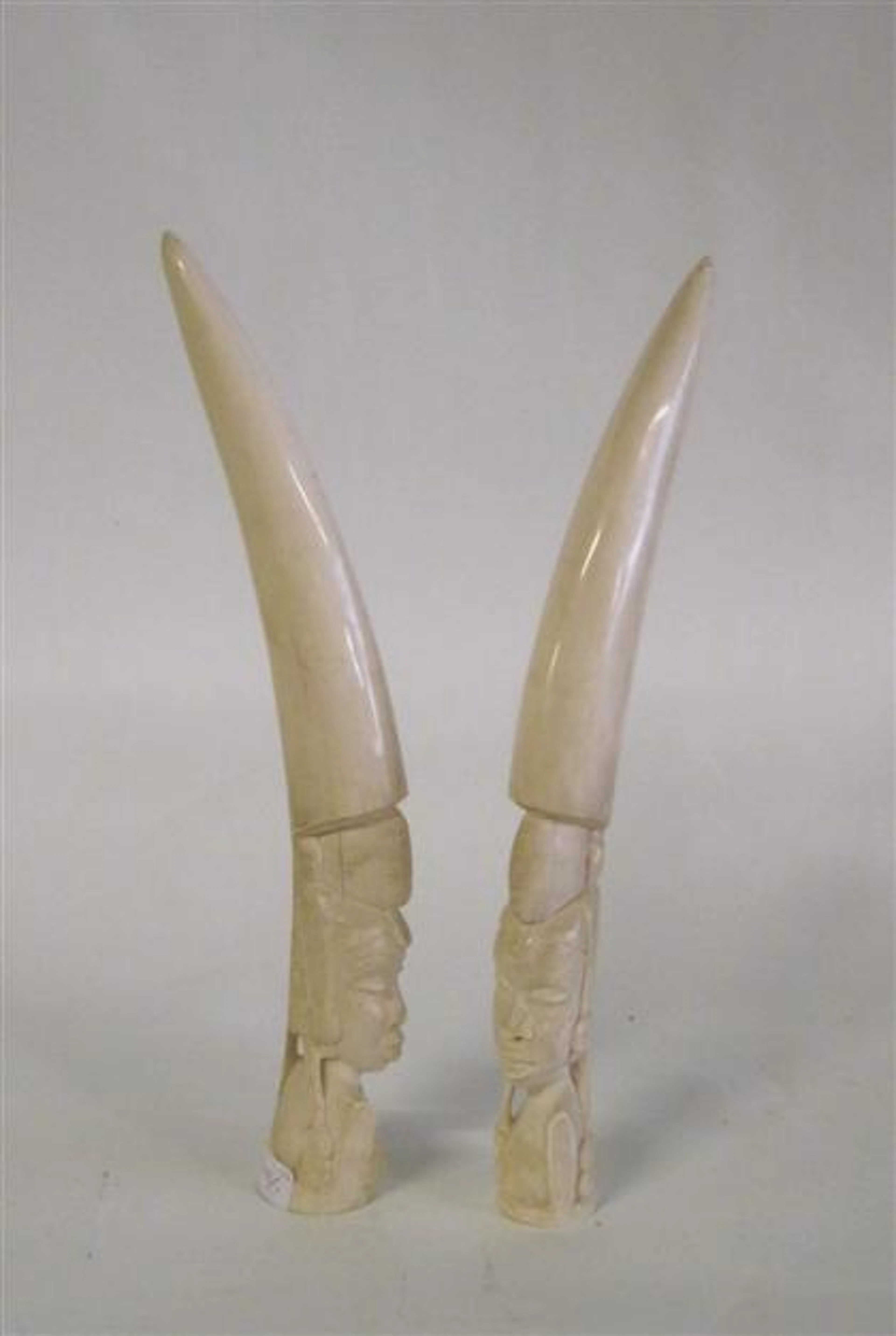 Pair of carved African elephant ivory tusks, H: 16 1/2 in.