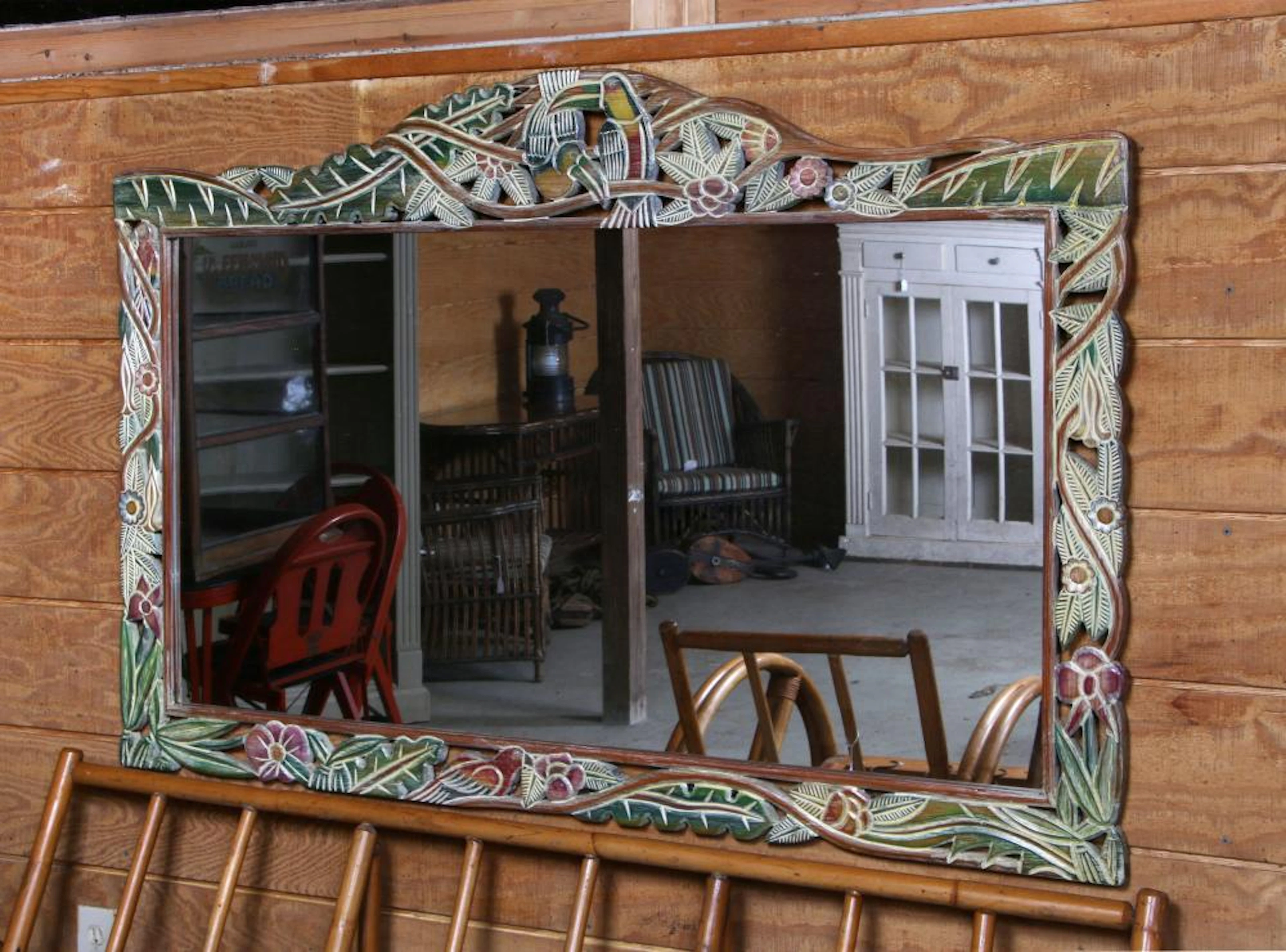 Painted carved mirror with tropical birds and foli