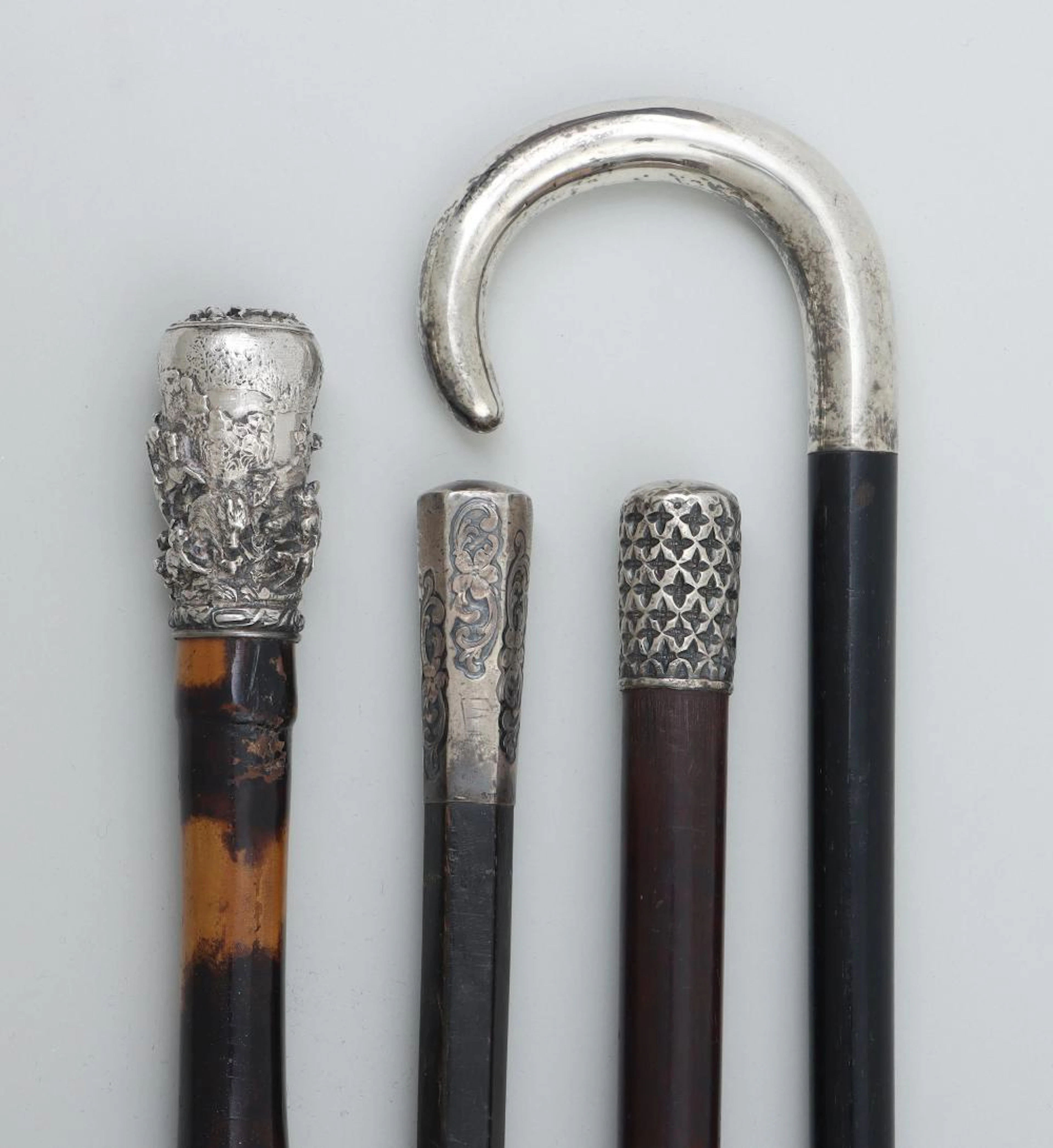 Group of (4) silver, wood and bamboo canes