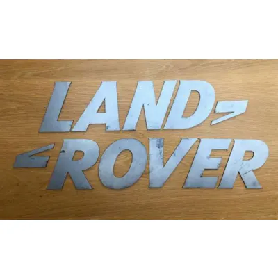 A font-correct 'Land Rover' sign in lazered-steel cut-outs | Barnebys
