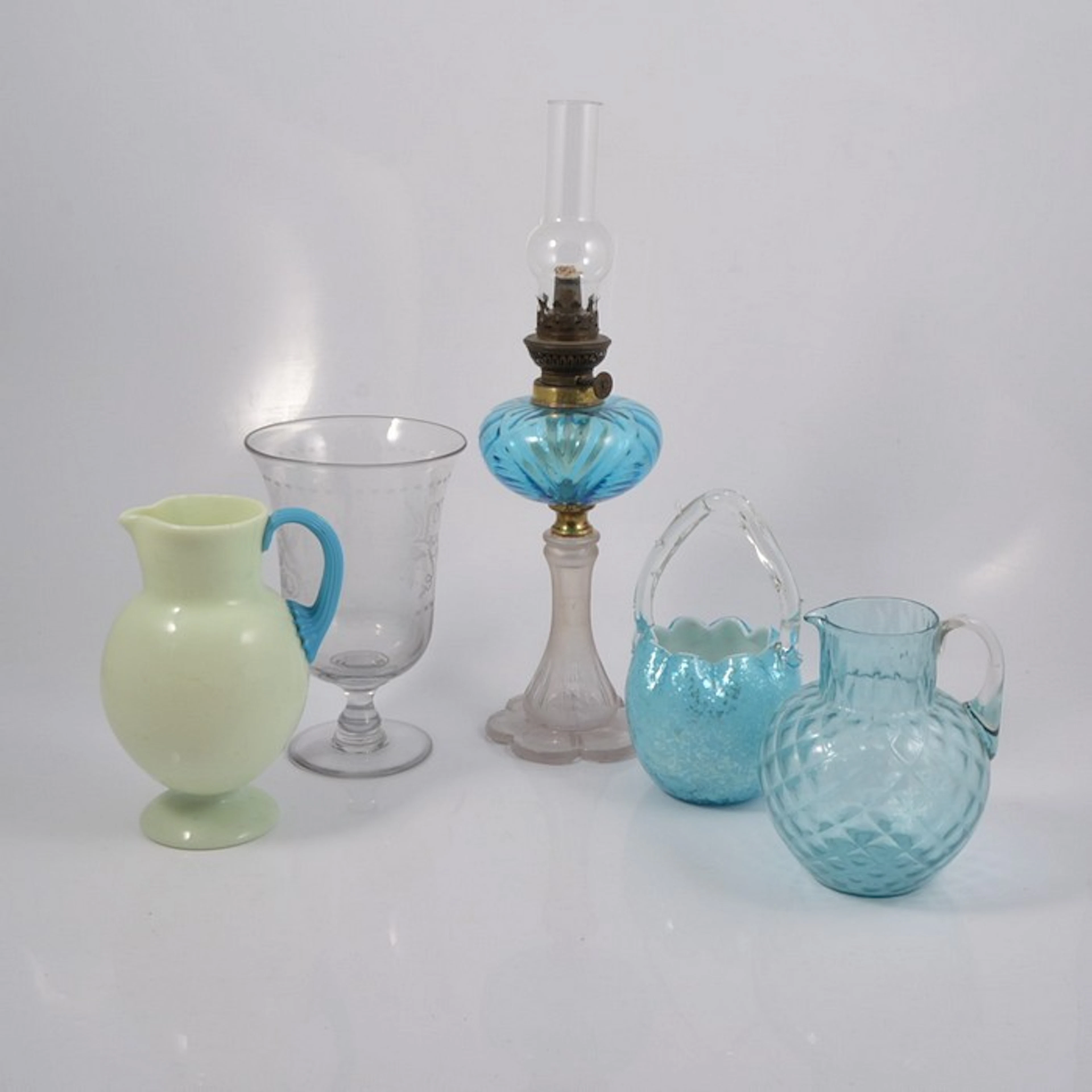 Collection of coloured glass jugs