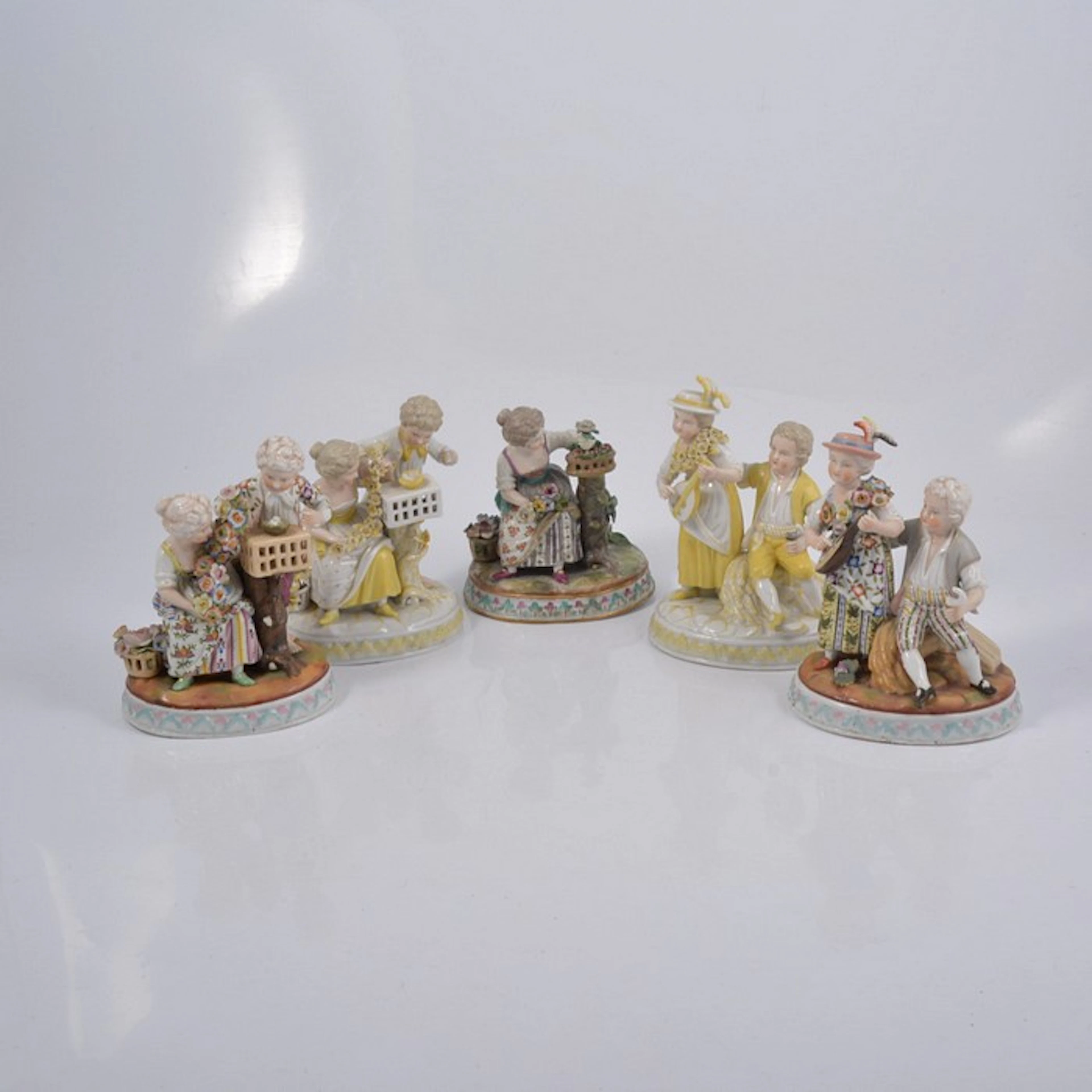 Pair of Meissen style porcelain figure groups