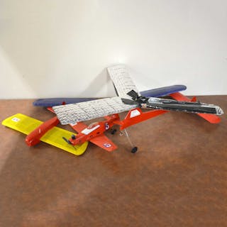 Three model aircraft airframes, with small glow engine