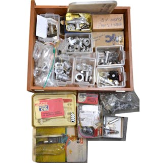 A tray containing engine parts, electronics, etc.
