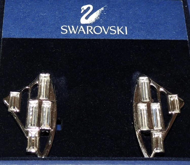 SWAROVSKI EARRINGS in silver metal and baguettes . In original box.