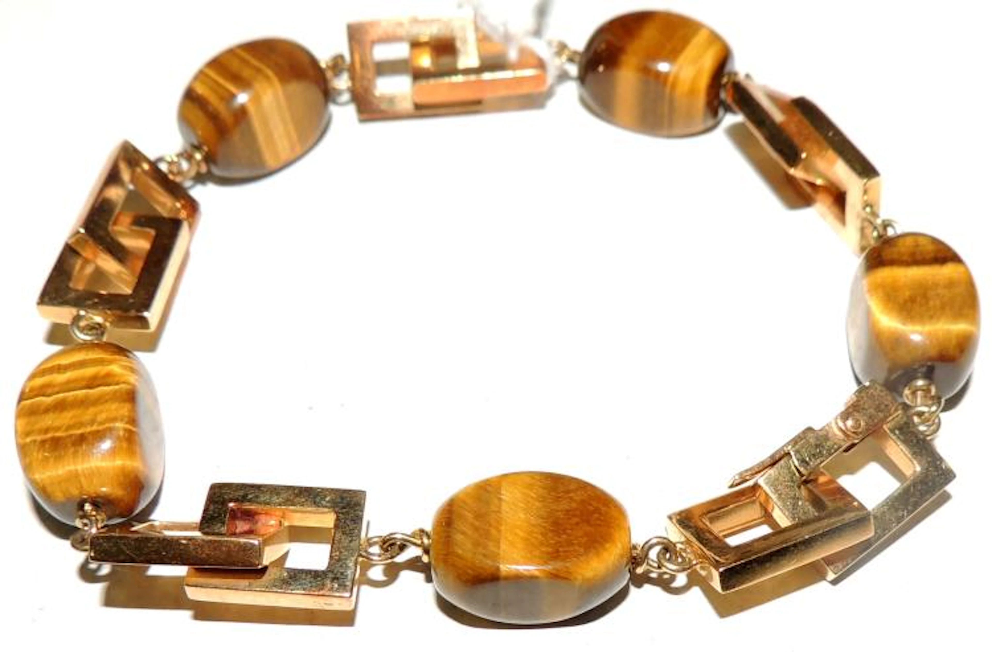 BRACELET in 18kt yellow gold and tiger's eye.