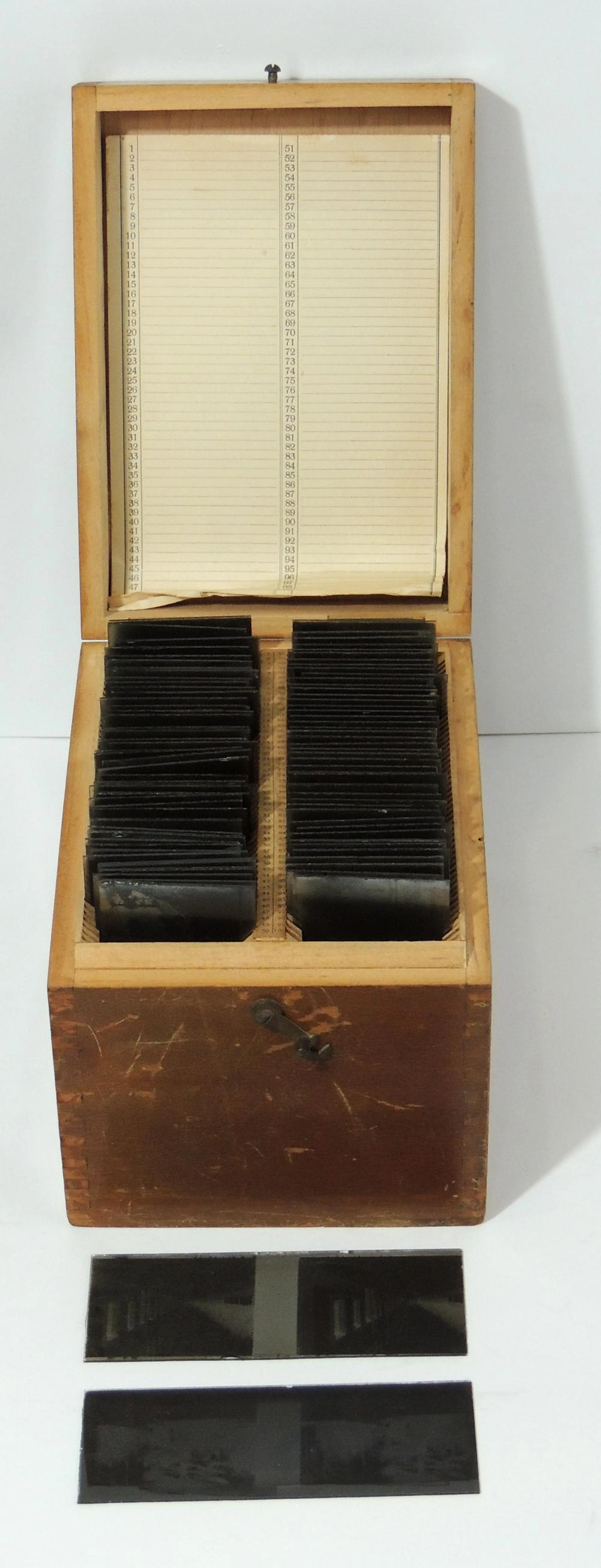 ANTIQUE NEGATIVE COLLECTION revealed in glass with wooden box.