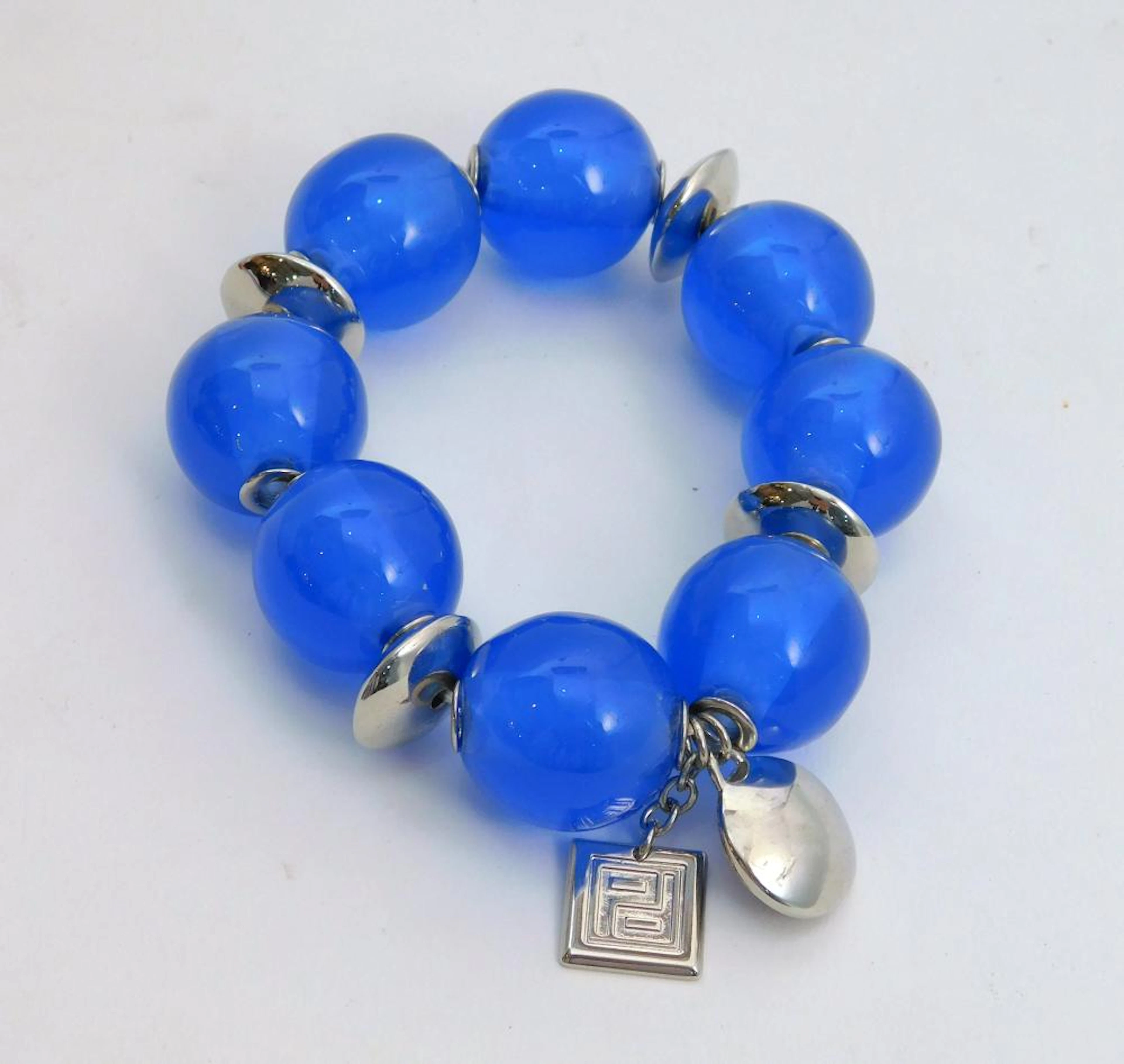 PERTEGAZ. PULSERA esférica color azul y plateada con logo de la casa