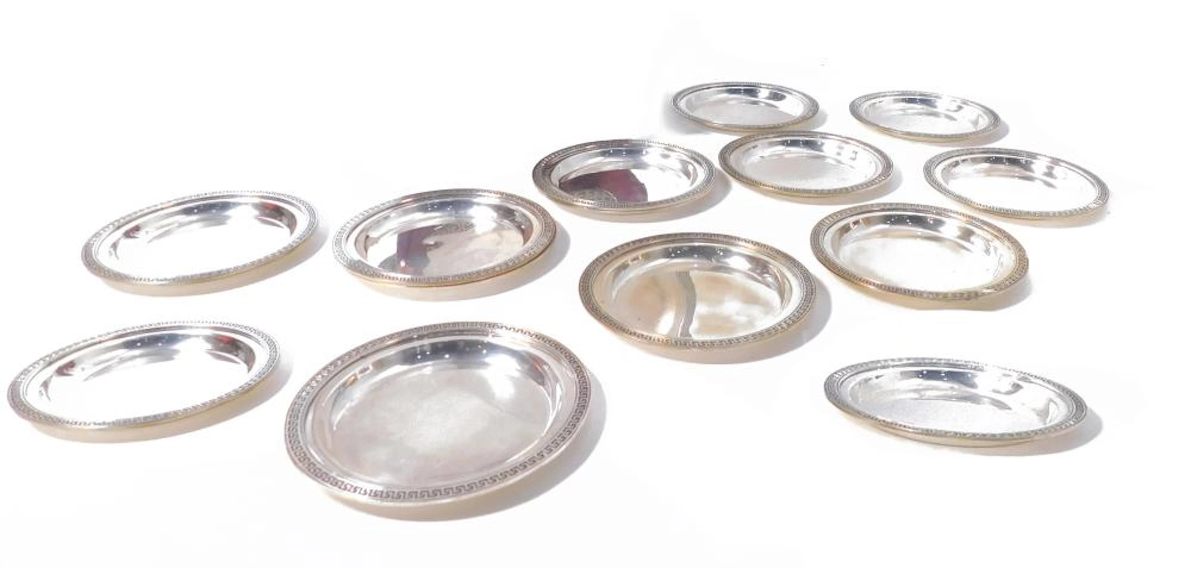 JUEGO D E 12 PLATOS PARA PAN en plata punzón Puig Doria...