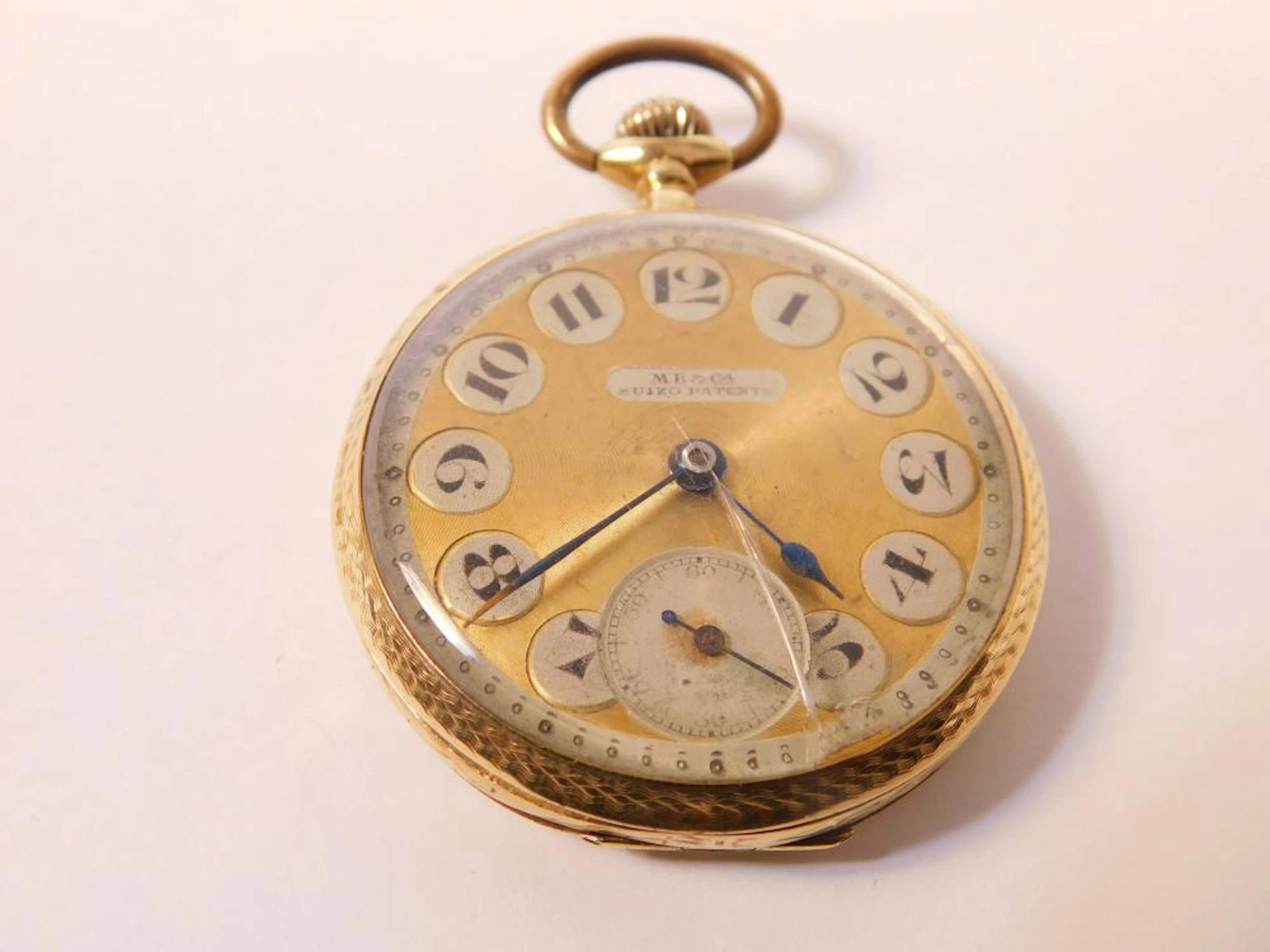 RELOJ DE BOLSILLO PATENTE SUIZA con tapa en oro cincelado Remontoir