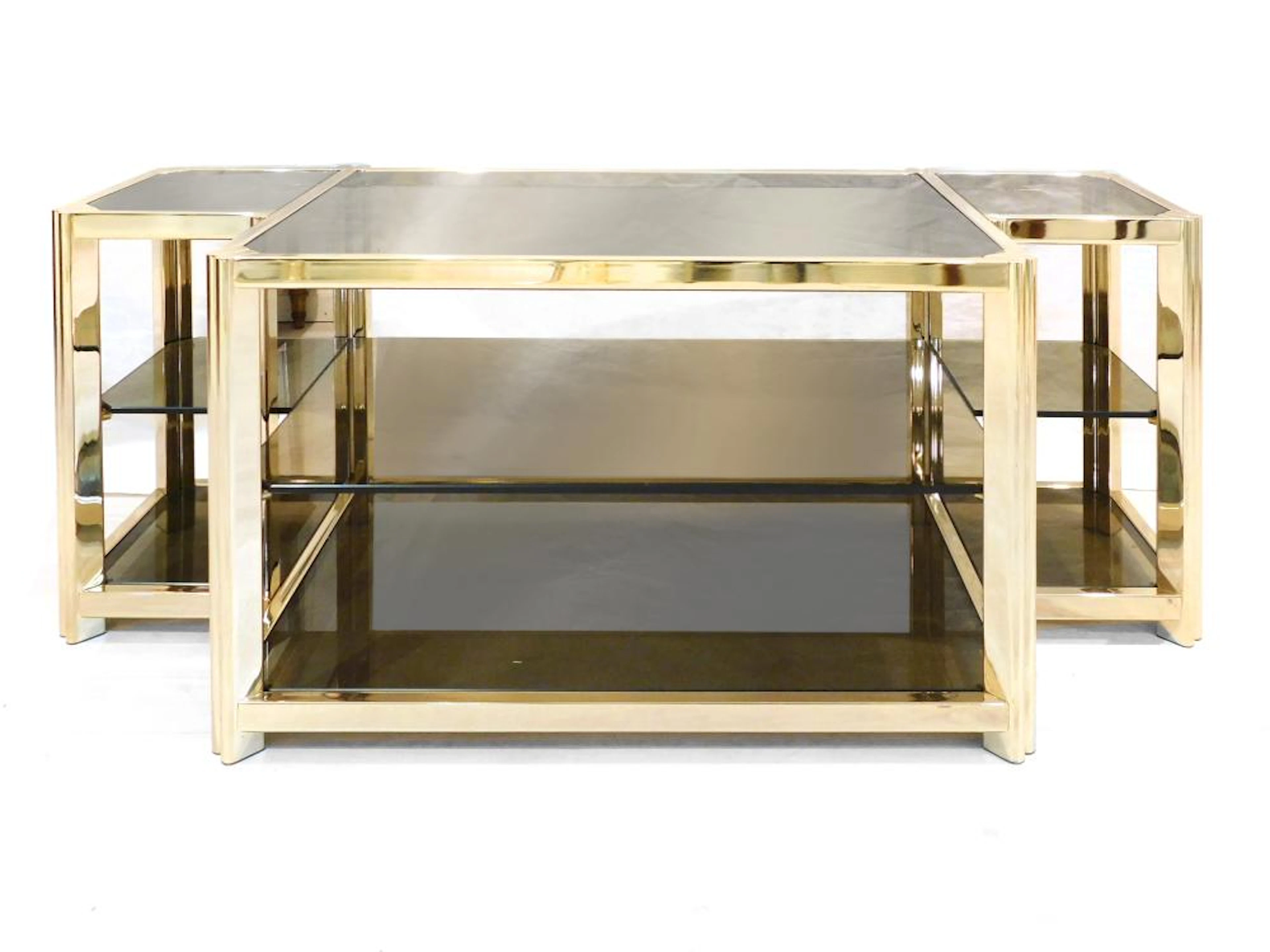 MUEBLE AUXILIAR estructura en metal dorado y cristal fumé de dos niveles