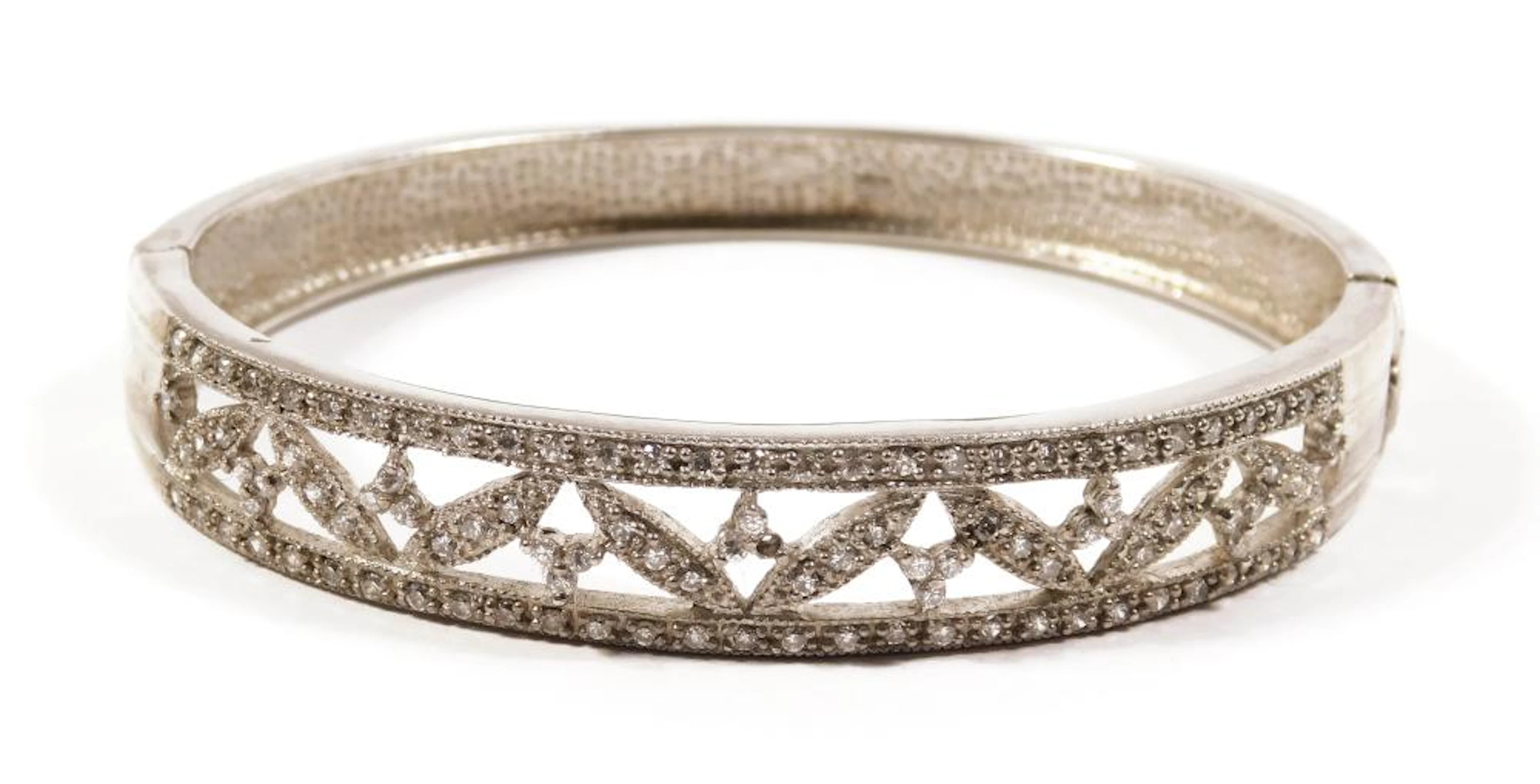 PULSERA TIPO ESCLAVA en plata calada con circonitas Peso: 25.1 gr.
