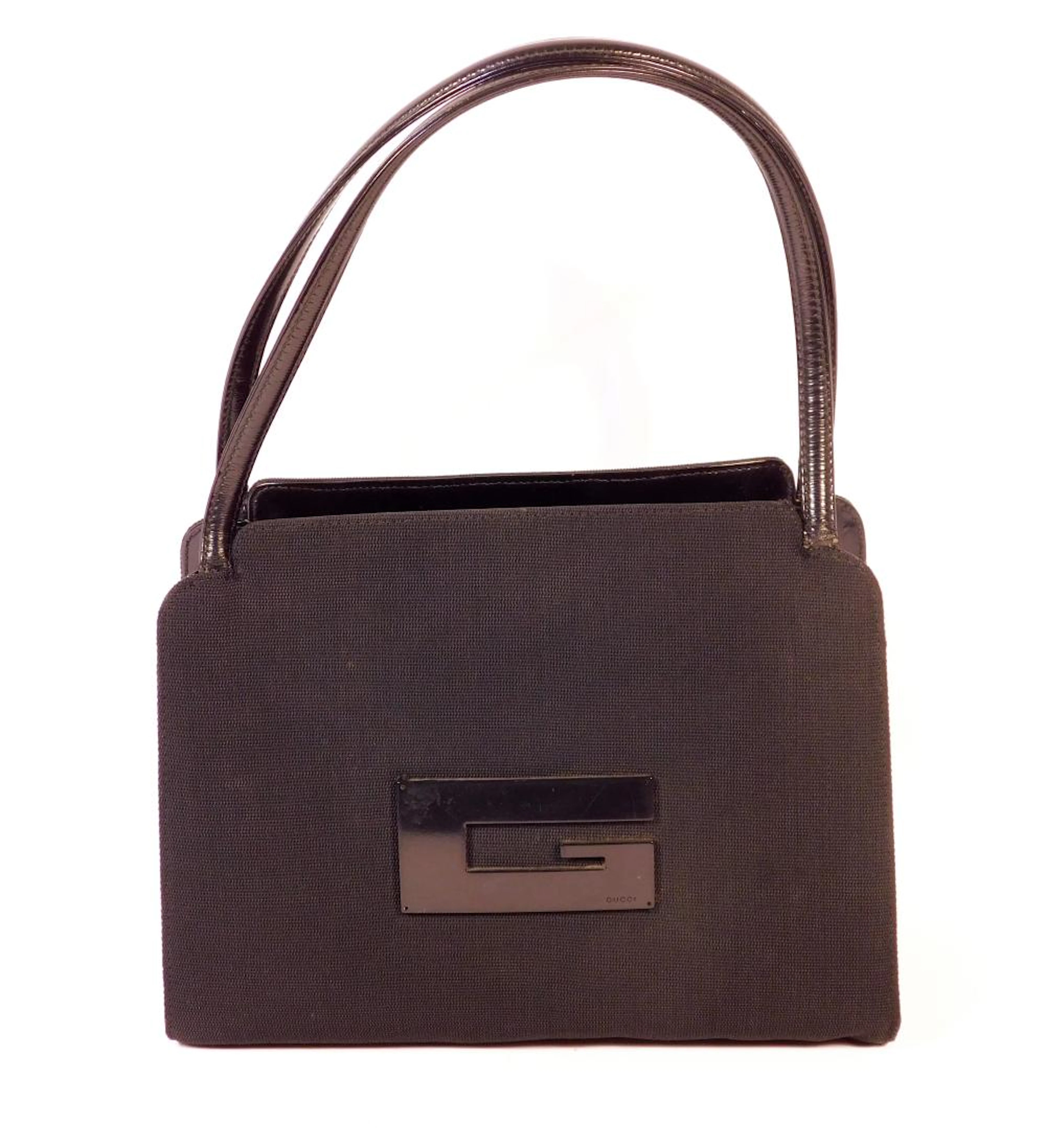 GUCCI. BOLSO NEGRO MODELO VINTAGE en tela y asas en piel...