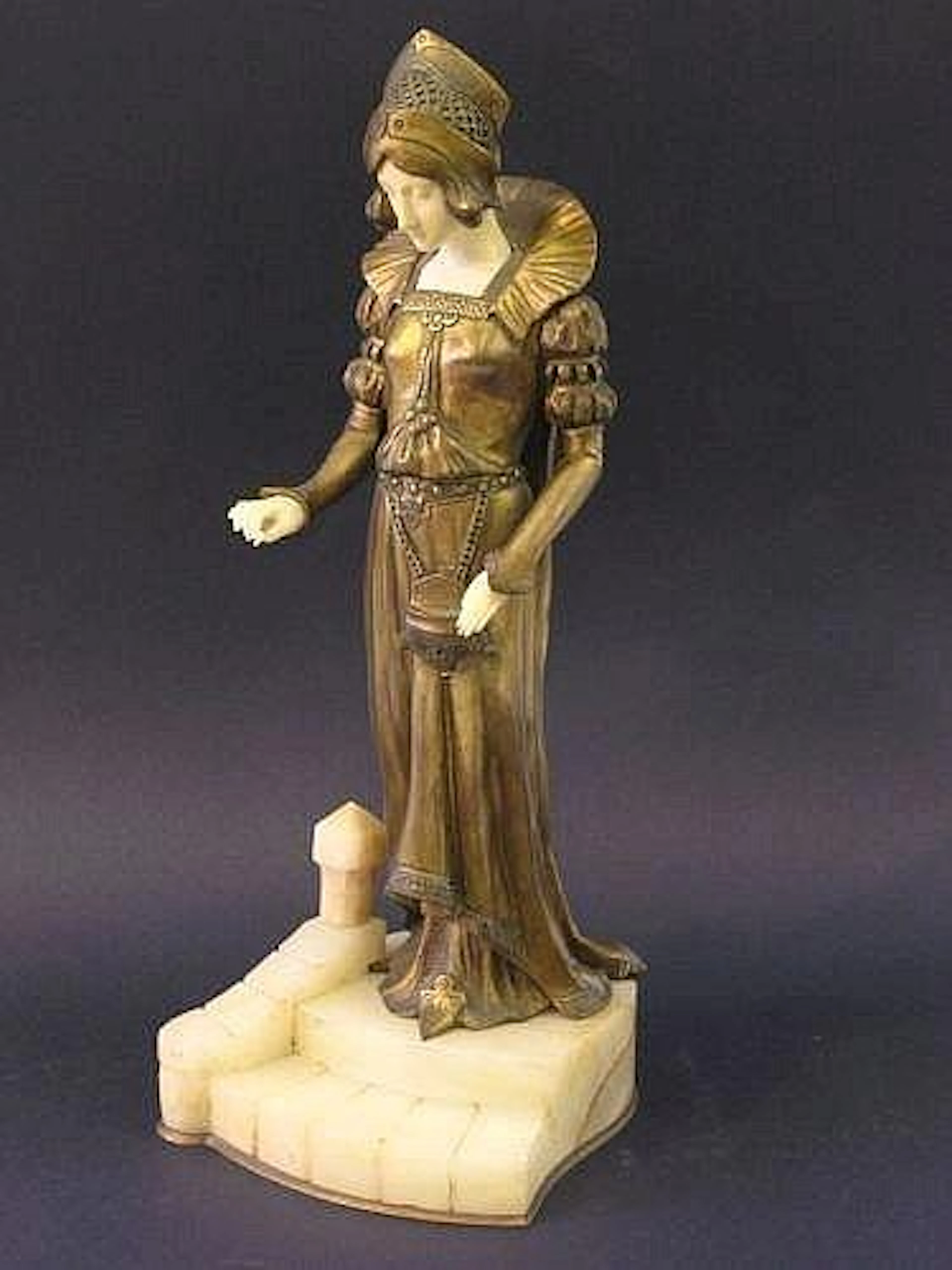 A David Alonzo bronze and ivory figure of a lady in...