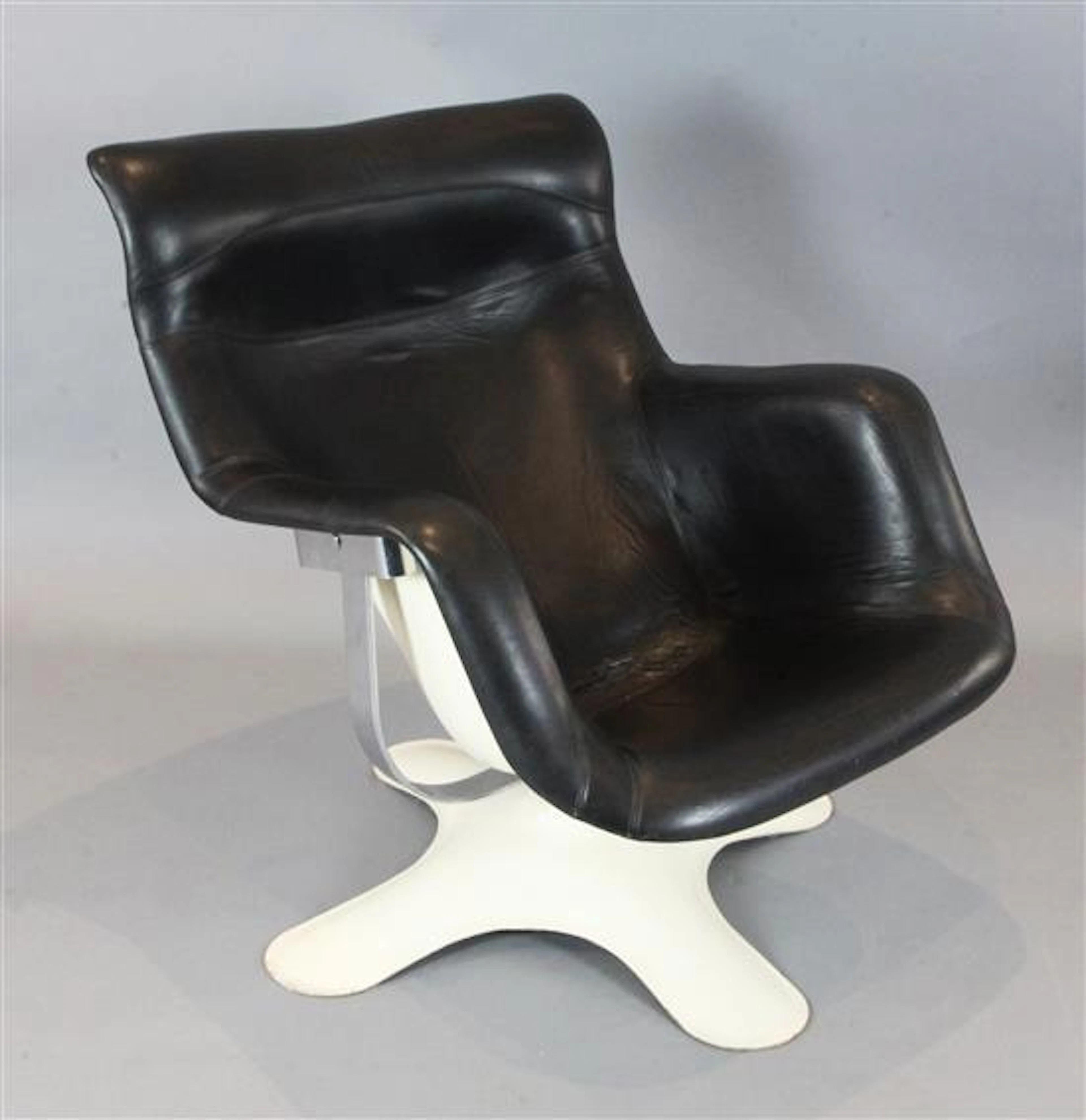 A vintage Karuselli black leather lounge chair