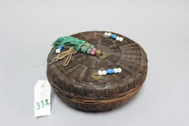 Circular sewing basket with chinese coin and silk tassels