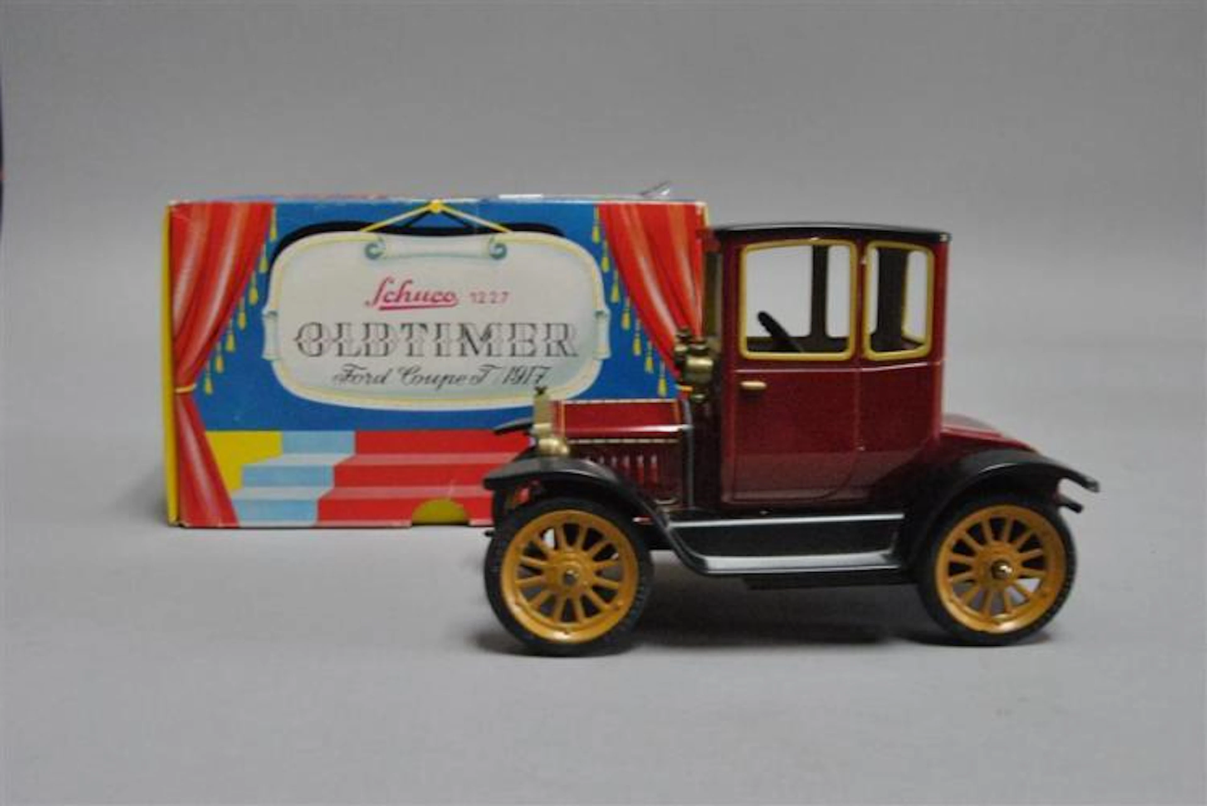 Schuco Oldtimer Ford Coupe T (1917 model replica), red, near mint condition in box