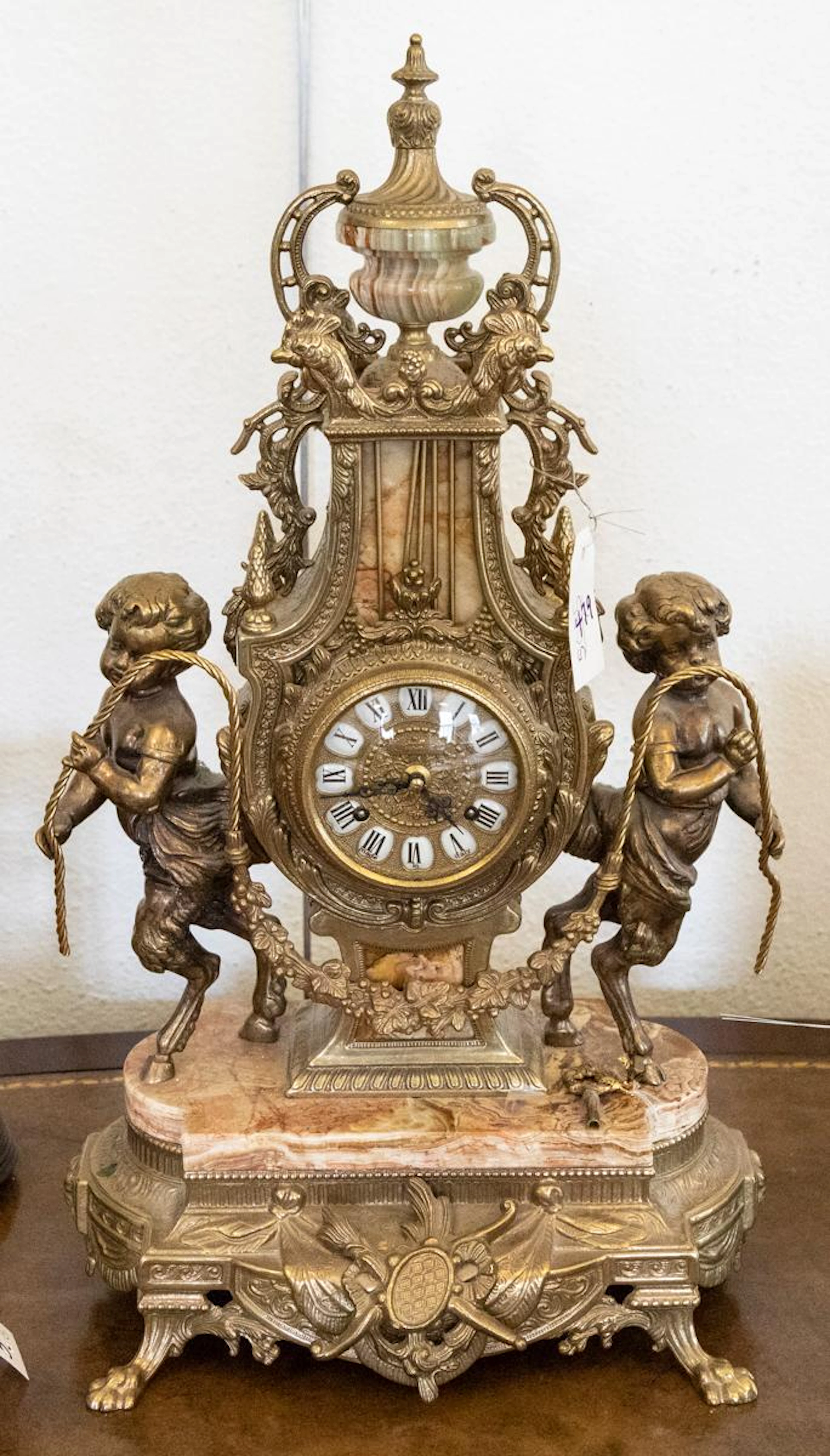 Gilt metal figural mantle clock with key, made in Italy