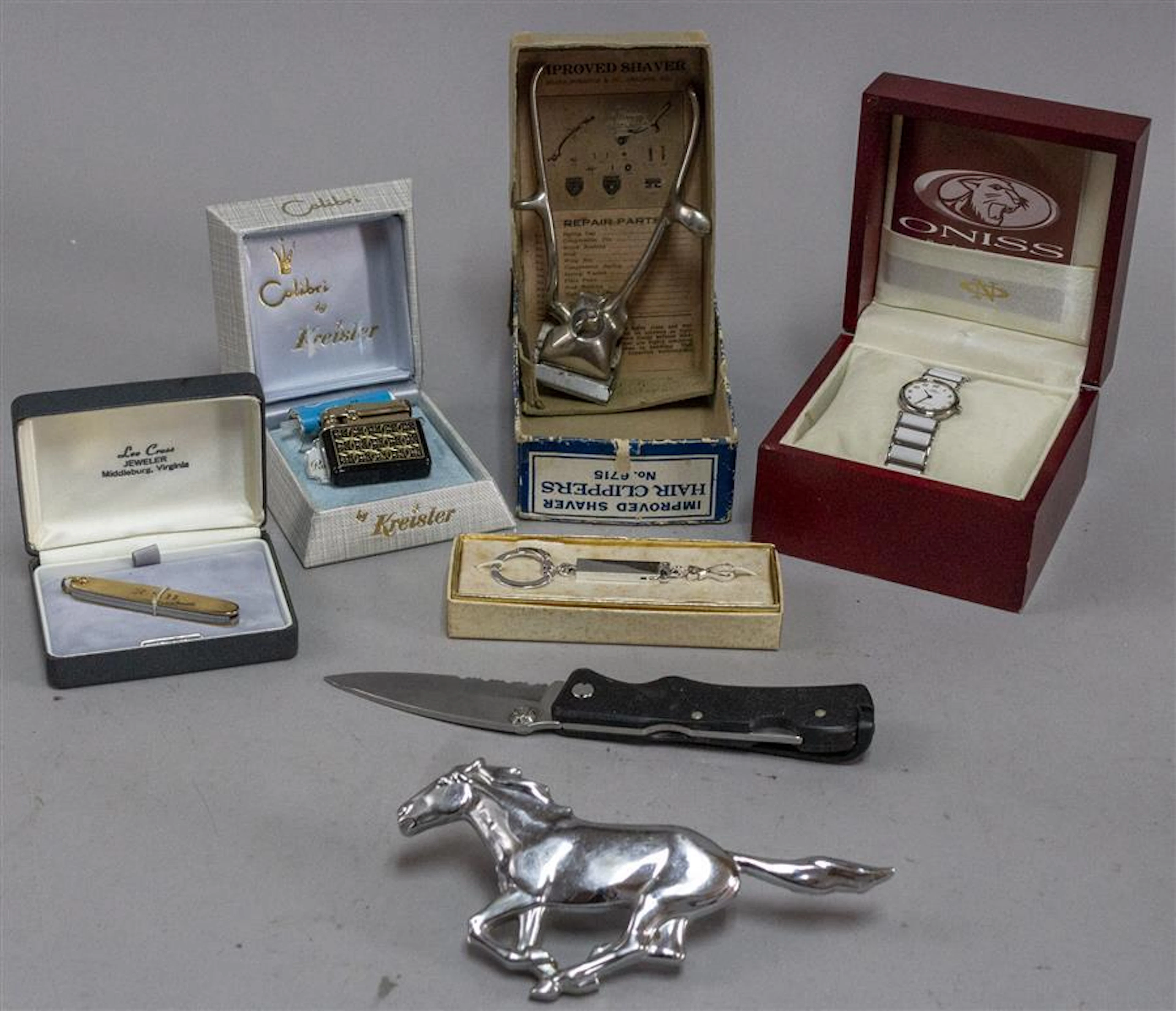 Collection of razors, pocket knives, lighters, straight edge razors, a wrist watch by Oniss, and key chains