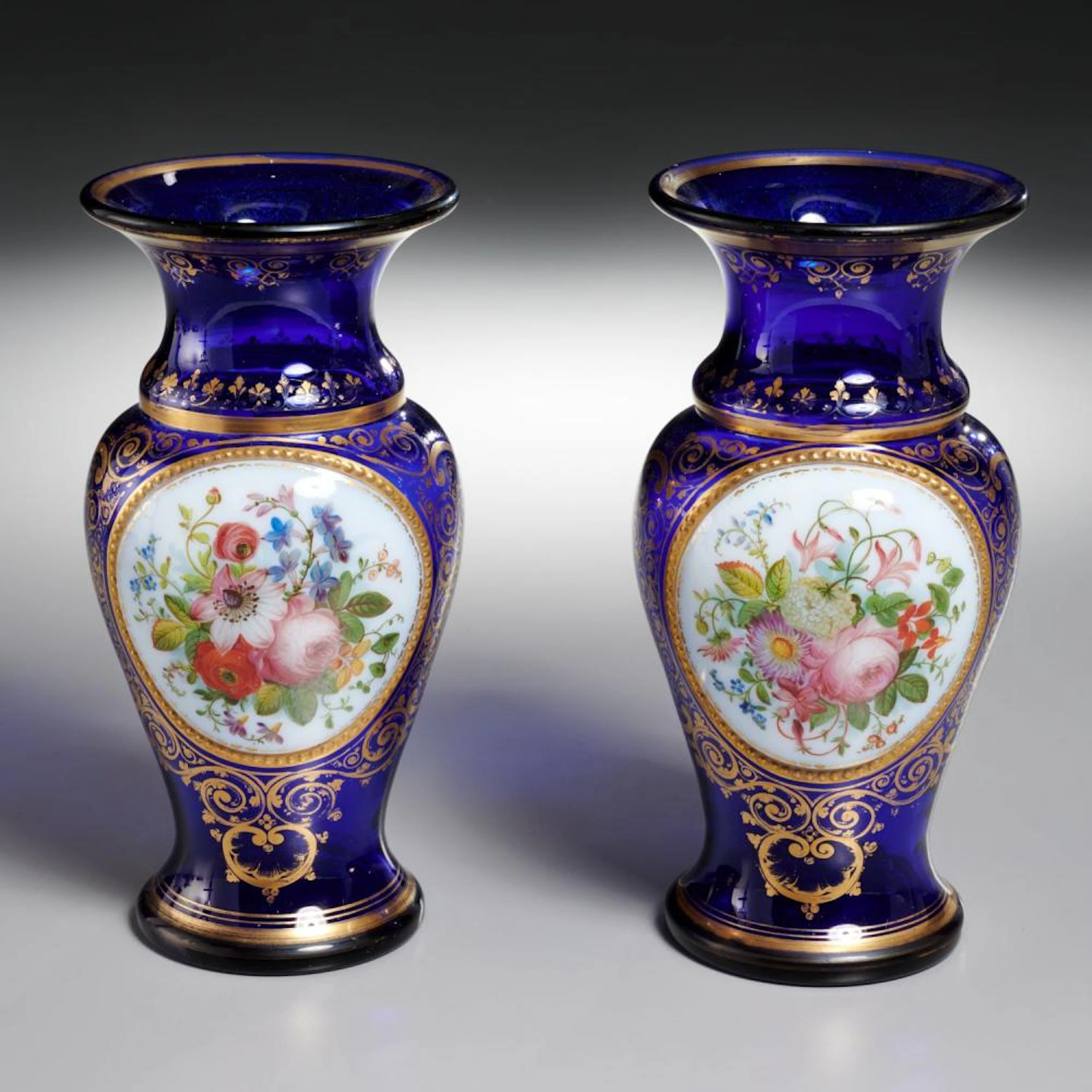 Pair Baccarat (attrib.) decorated glass vases