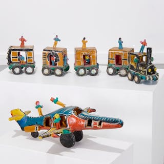 Vintage Mexican folk art train and airplane