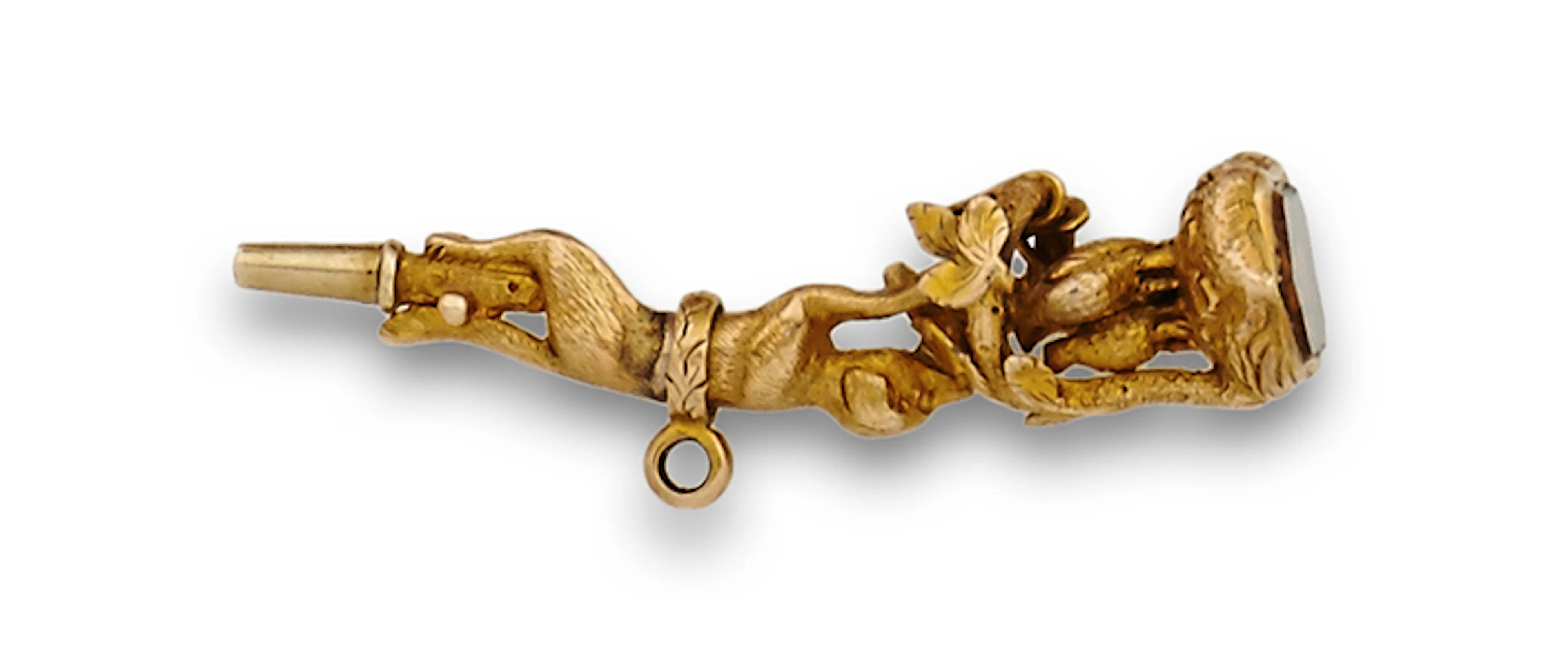 Interesante llave de reloj colgante,s.XIX en oro de 18K. Con figura